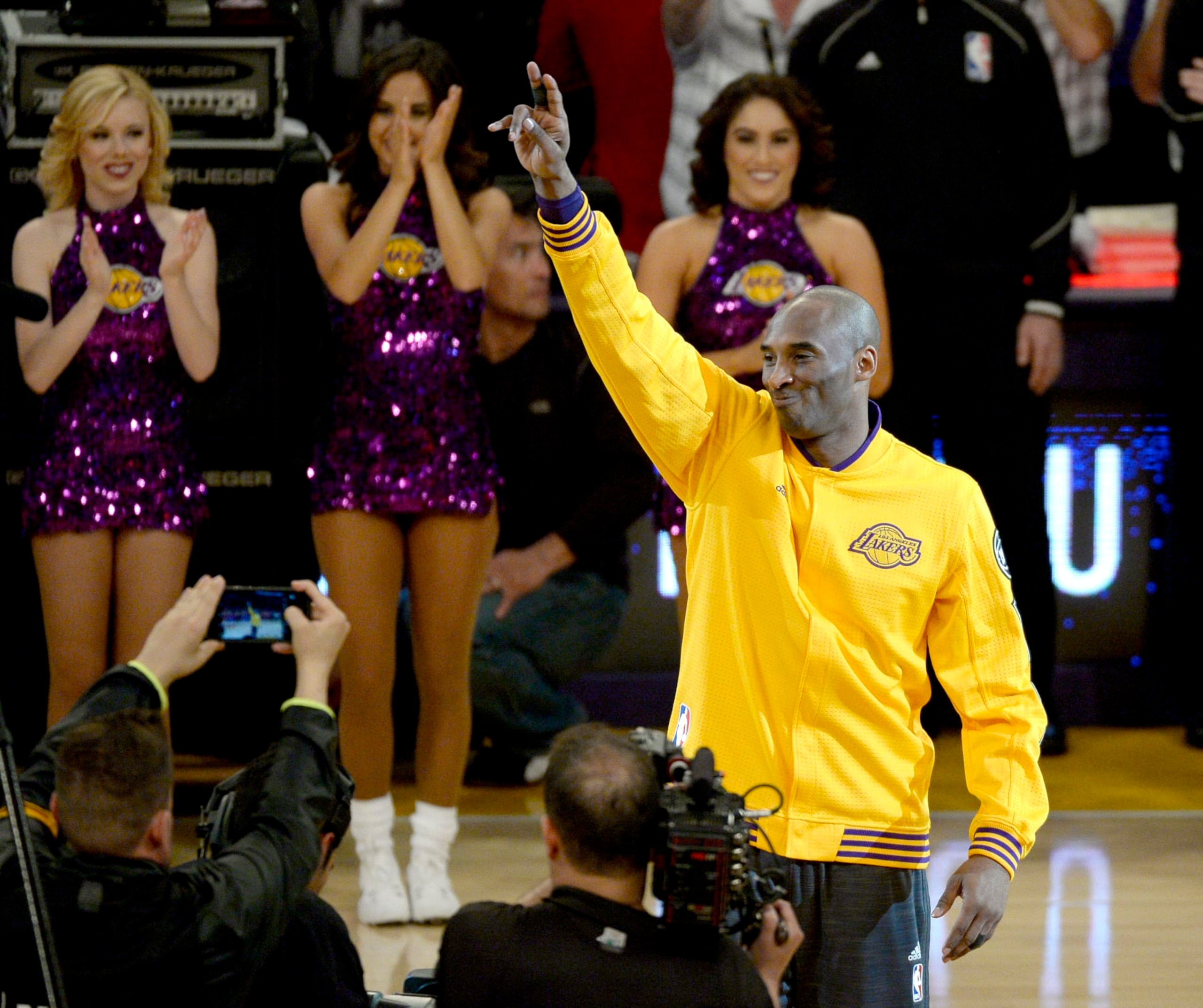 LOS ANGELES, CA - APRIL 13:  Kobe Bryant #24 of the Los Angeles Lakers waves to the crowd as he walks on the court before the game against the Utah Jazz on April 13, 2016 at Staples Center in Los Angeles, California.  (Photo by Kevork Djansezian/Getty Images)