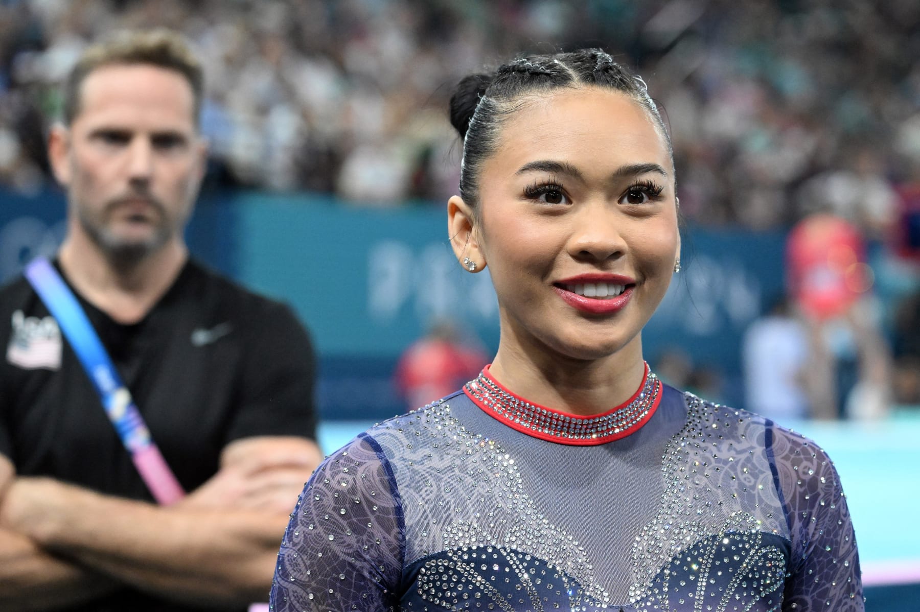 USA's Sunisa Lee reacts after performing on the uneven bars during the Women's All-Around Artistic Gymnastics championship during the 2024 Paris Summer Olympics, at the Bercy Arena in Paris, France, August 1, 2024. (Photo by Anthony Behar/Sipa USA) (Photo by Anthony Behar / BELGA MAG / Belga via AFP) (Photo by ANTHONY BEHAR/BELGA MAG/AFP via Getty Images)