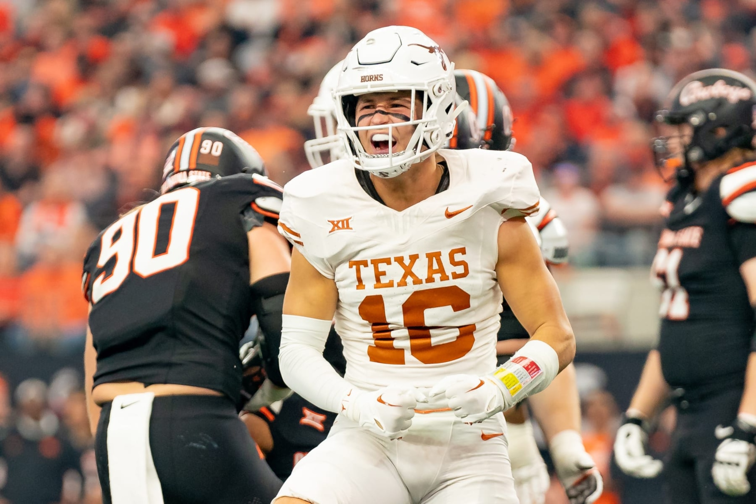 ARLINGTON, TX - DECEMBER 02: Texas Longhorns defensive back Michael Taaffe (16) celebrates a tackle during the Big 12 Championship game between the Texas Longhorns and the Oklahoma State Cowboys on December 02, 2023 at AT&T Stadium in Arlington, TX. (Photo by Chris Leduc/Icon Sportswire via Getty Images) ARLINGTON, TX - DECEMBER 02: Texas Longhorns defensive back Michael Taaffe (16) celebrates a tackle during the Big 12 Championship game between the Texas Longhorns and the Oklahoma State Cowboys on December 02, 2023 at AT&T Stadium in Arlington, TX. (Photo by Chris Leduc/Icon Sportswire via Getty Images)