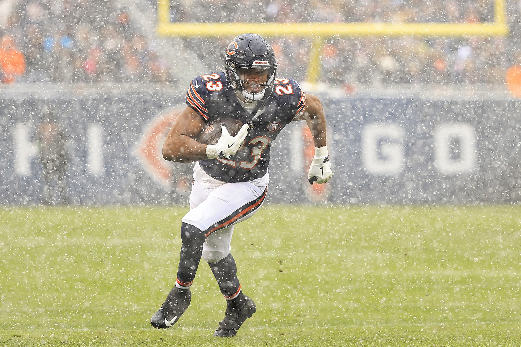 CHICAGO, ILLINOIS - DECEMBER 31: Roschon Johnson #23 of the Chicago Bears runs the ball during the first half against the Los Angeles Rams at Soldier Field on December 31, 2023 in Chicago, Illinois. (Photo by Justin Casterline/Getty Images)