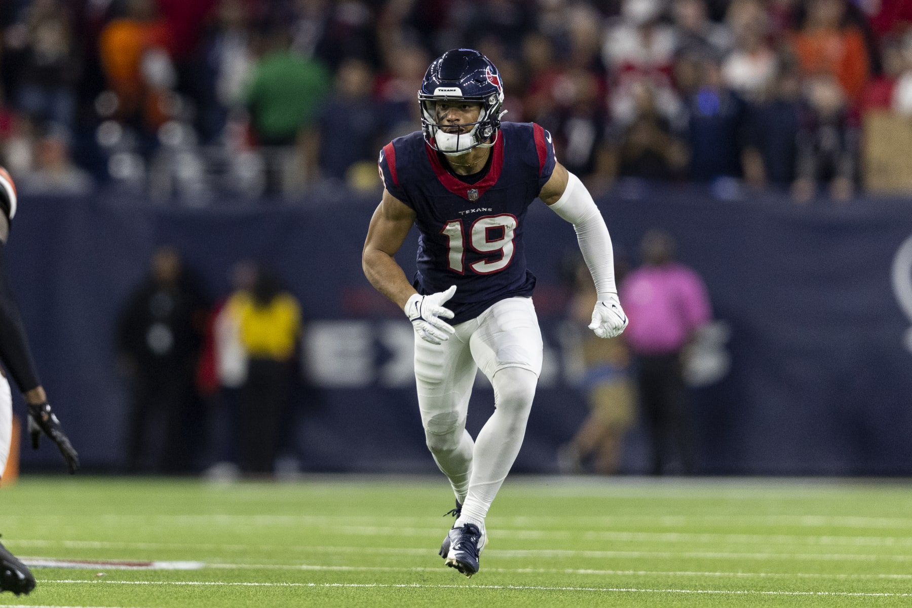 HOUSTON, TEXAS - JANUARY 13: Xavier Hutchinson #19 of the Houston Texans runs during an NFL wild-card playoff football game between the Houston Texans and the Cleveland Browns at NRG Stadium on January 13, 2024 in Houston, Texas. (Photo by Michael Owens/Getty Images)