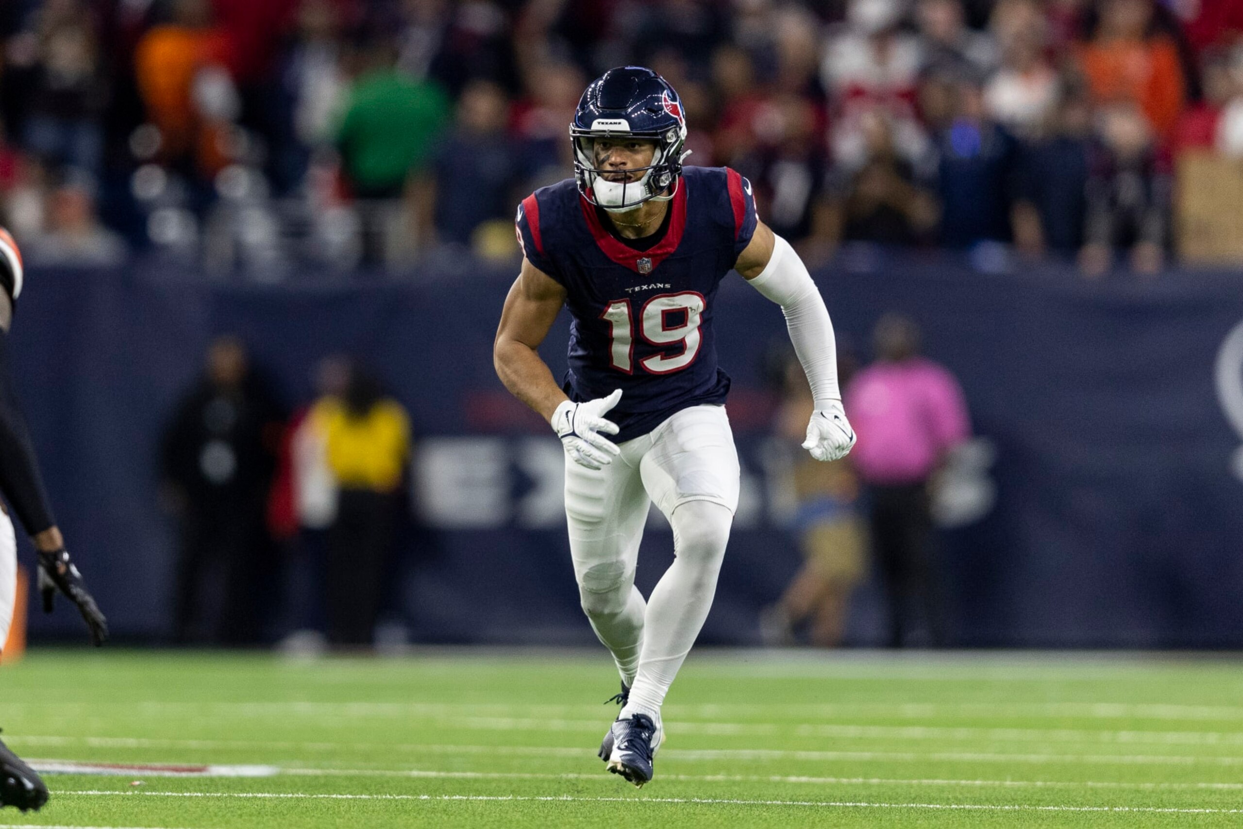 HOUSTON, TEXAS - JANUARY 13: Xavier Hutchinson #19 of the Houston Texans runs during an NFL wild-card playoff football game between the Houston Texans and the Cleveland Browns at NRG Stadium on January 13, 2024 in Houston, Texas. (Photo by Michael Owens/Getty Images)