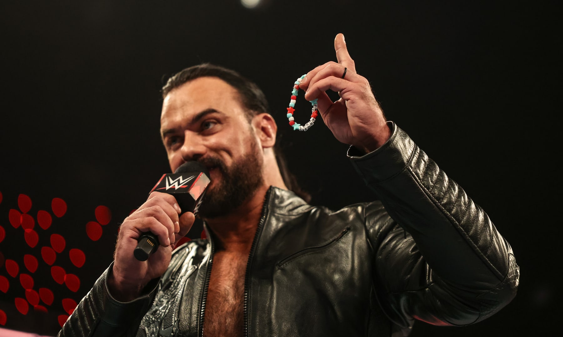 INDIANAPOLIS, INDIANA - JUNE 24: Drew McIntyre speaks while holding CM Punk's bracelet during Monday Night RAW at Gainbridge Fieldhouse on June 24, 2024 in Indianapolis, Indiana. (Photo by WWE/Getty Images)