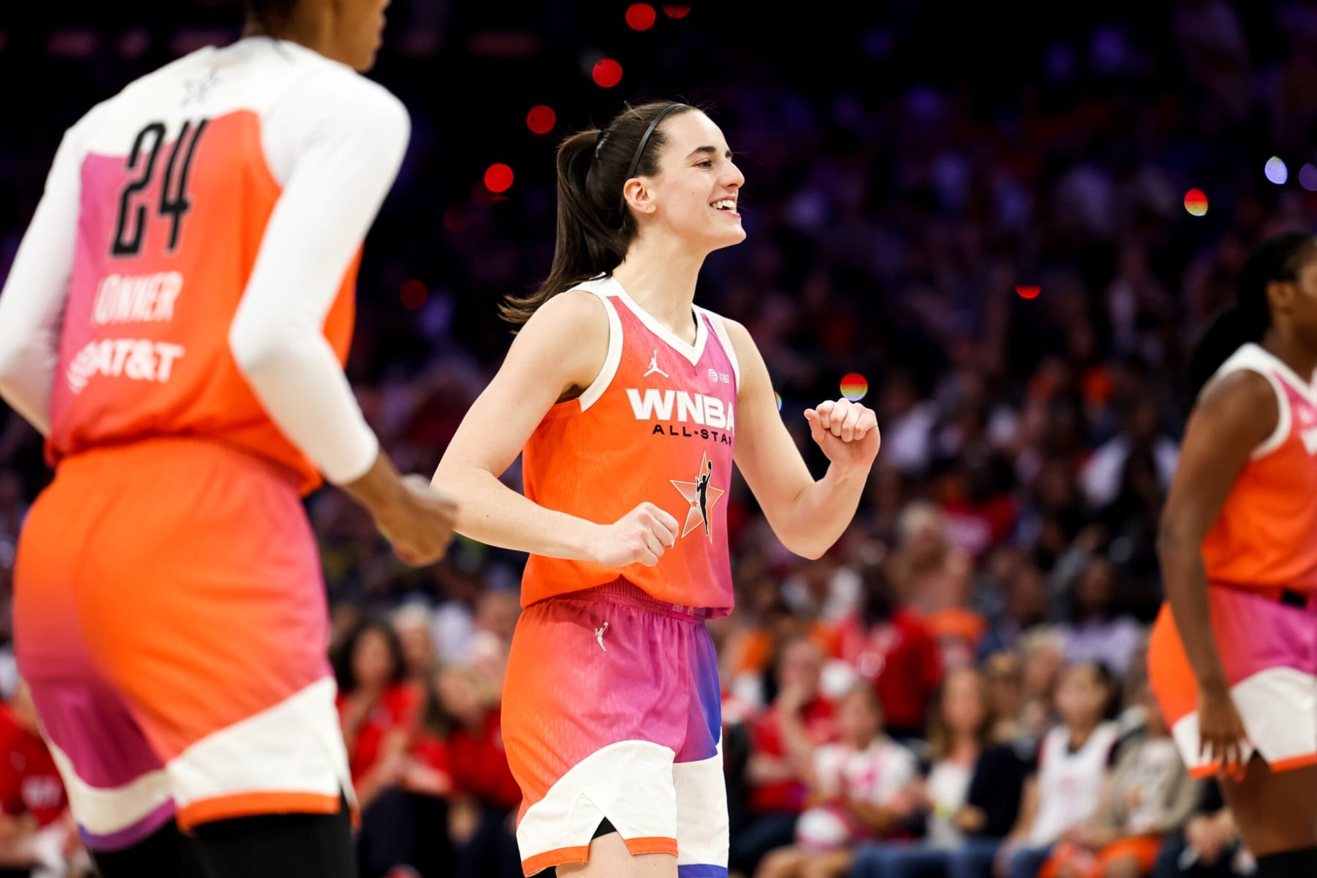 PHOENIX, AZ - JULY 20: Caitlin Clark #22 of Team WNBA smiles during the 2024 WNBA All Star Game at Footprint Center on July 20, 2024 in Phoenix, Arizona. NOTE TO USER: User expressly acknowledges and agrees that, by downloading and/or using this Photograph, user is consenting to the terms and conditions of the Getty Images License Agreement. Mandatory Copyright Notice: Copyright 2024 NBAE (Photo by Dylan Goodman/NBAE via Getty Images)