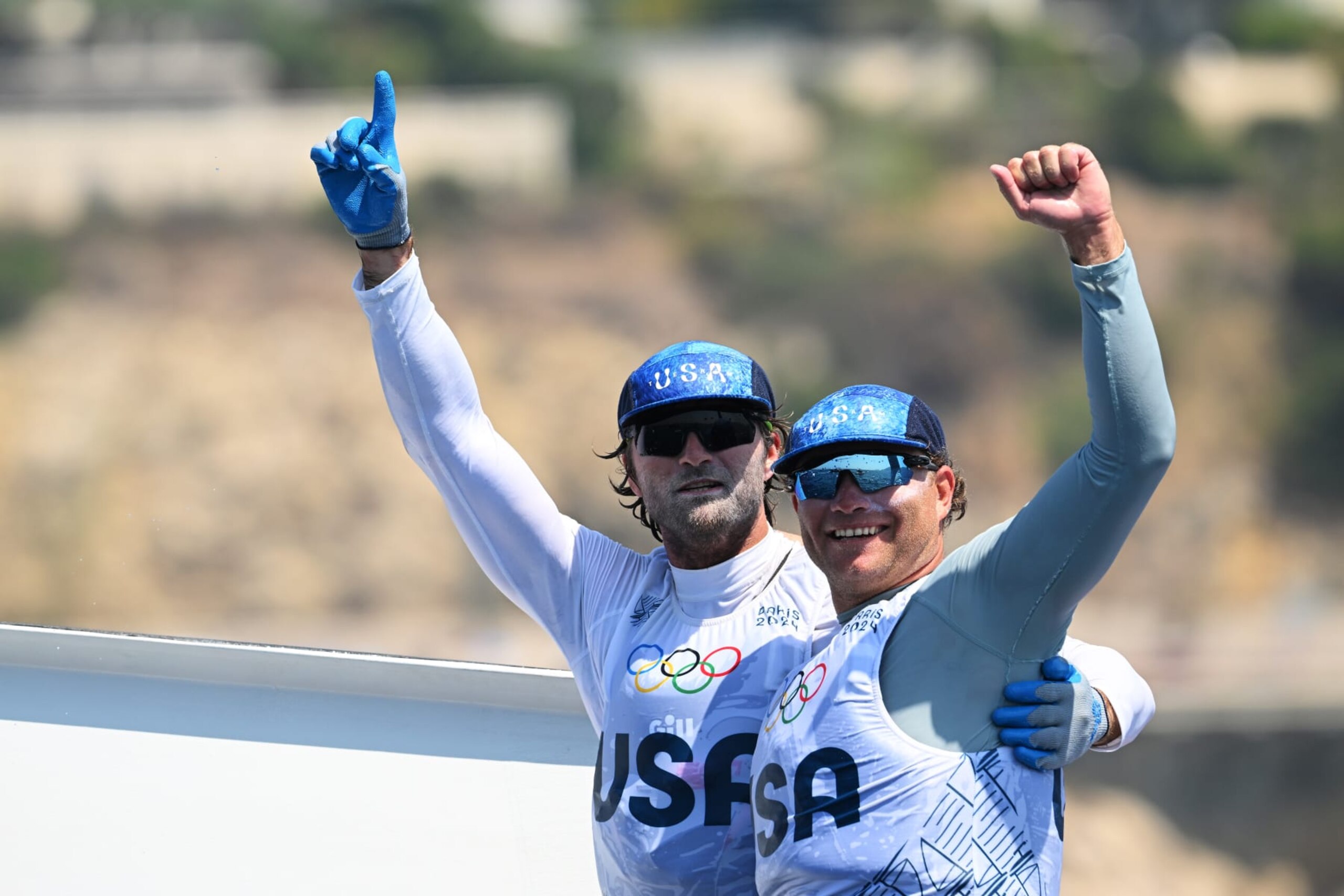 MARSEILLE, FRANCE - AUGUST 02: Ian Barrows and Hans Henken of Team United States celebrate bronze in the Men's Skiff 49erFX class medal race on day seven of the Olympic Games Paris 2024 at Marseille Marina on August 02, 2024 in Marseille, France. (Photo by Clive Mason/Getty Images)
