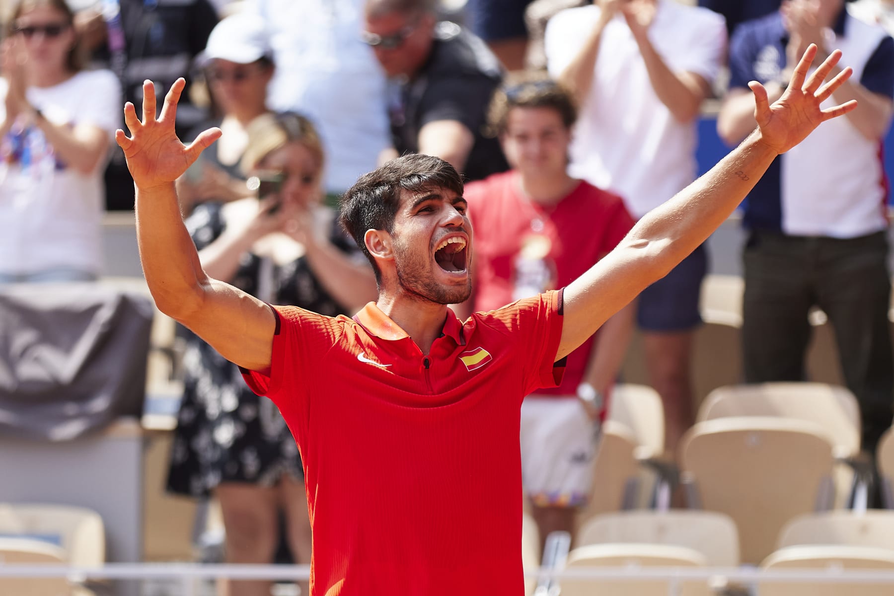 PARIS, FRANCE - AUGUST 02: Carlos Alcaraz of Team Spain celebrates after winning match point during the Tennis Men's Singles Semifinal match against Felix Auger-Aliassime of Team Canada on day seven of the Olympic Games Paris 2024 at Roland Garros on August 02, 2024 in Paris, France. (Photo by Quality Sport Images/Getty Images)