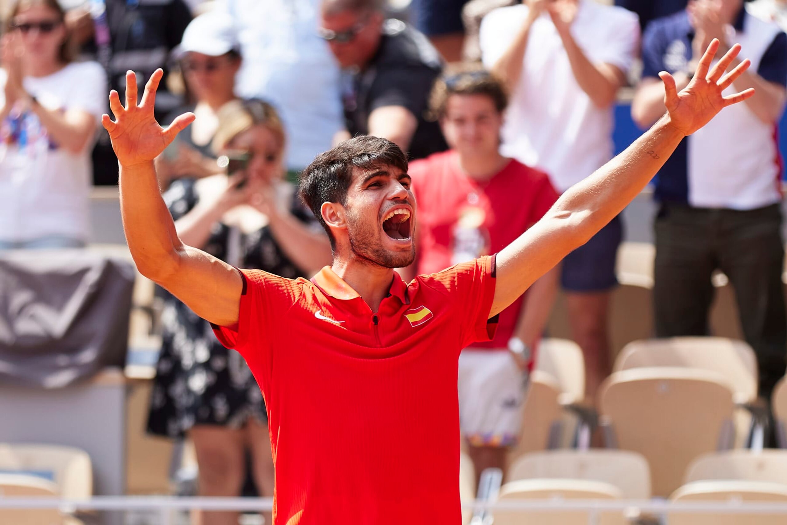 PARIS, FRANCE - AUGUST 02: Carlos Alcaraz of Team Spain celebrates after winning match point during the Tennis Men's Singles Semifinal match against Felix Auger-Aliassime of Team Canada on day seven of the Olympic Games Paris 2024 at Roland Garros on August 02, 2024 in Paris, France. (Photo by Quality Sport Images/Getty Images)