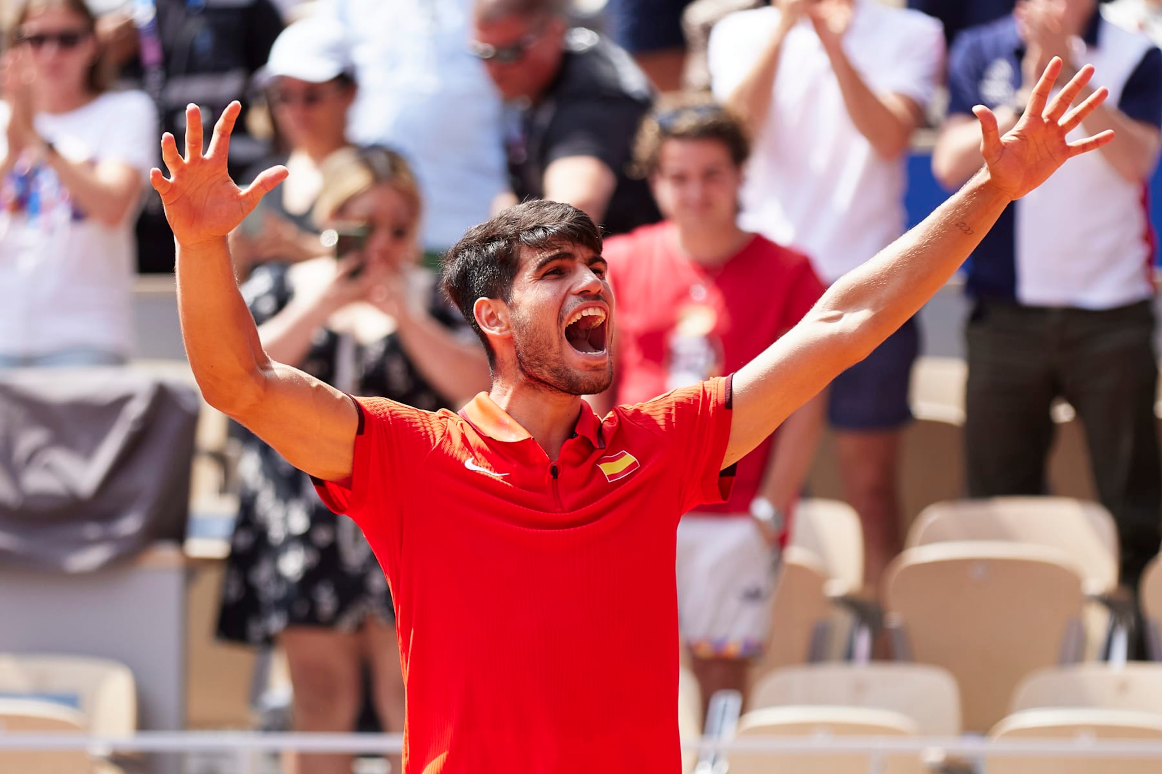 PARIS, FRANCE - AUGUST 02: Carlos Alcaraz of Team Spain celebrates after winning match point during the Tennis Men's Singles Semifinal match against Felix Auger-Aliassime of Team Canada on day seven of the Olympic Games Paris 2024 at Roland Garros on August 02, 2024 in Paris, France. (Photo by Quality Sport Images/Getty Images)