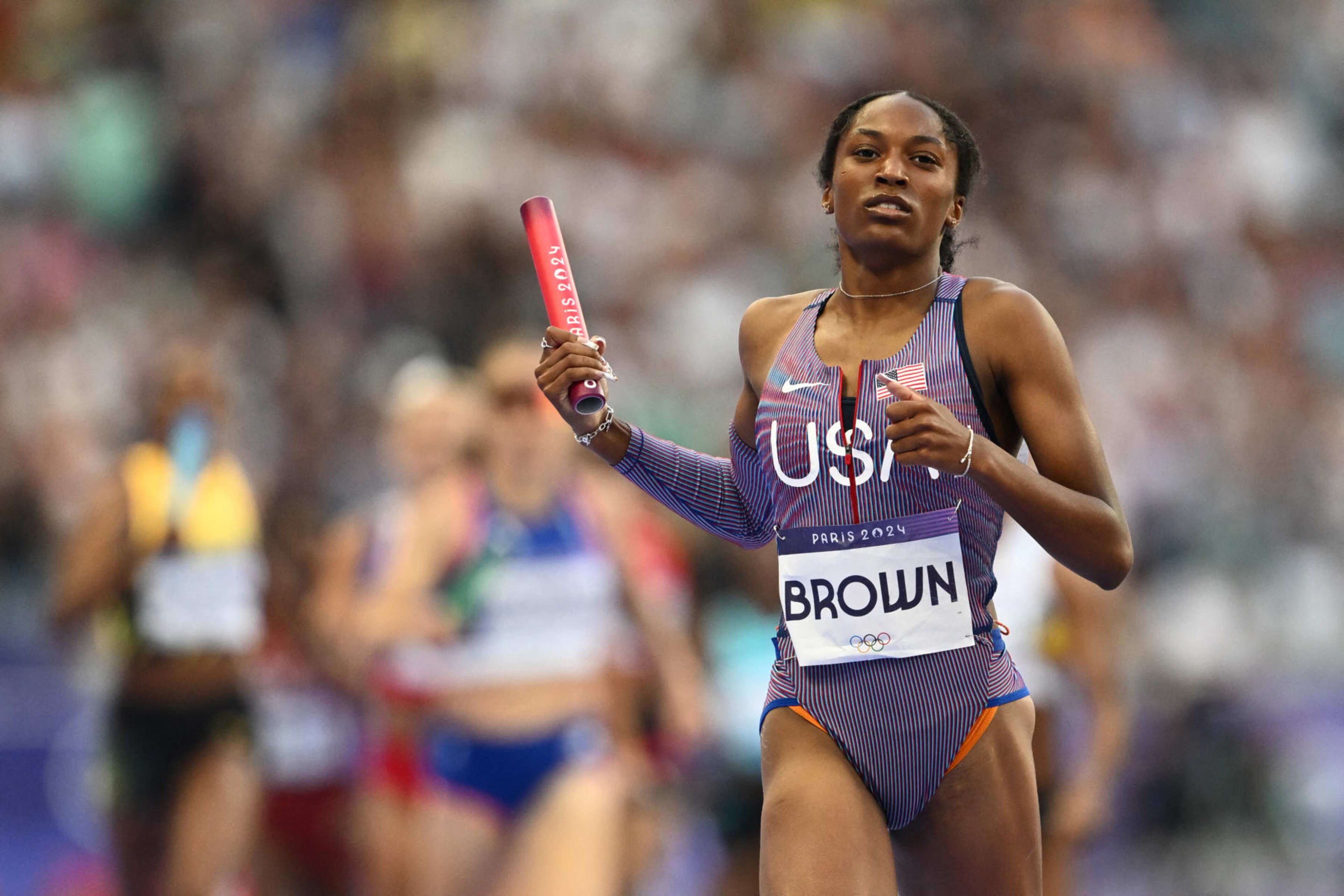 US' Kaylyn Brown runs with the baton in the mixed 4x400m relay heat of the athletics event at the Paris 2024 Olympic Games at Stade de France in Saint-Denis, north of Paris, on August 2, 2024. (Photo by Jewel SAMAD / AFP) (Photo by JEWEL SAMAD/AFP via Getty Images) US' Kaylyn Brown runs with the baton in the mixed 4x400m relay heat of the athletics event at the Paris 2024 Olympic Games at Stade de France in Saint-Denis, north of Paris, on August 2, 2024. (Photo by Jewel SAMAD / AFP) (Photo by JEWEL SAMAD/AFP via Getty Images)