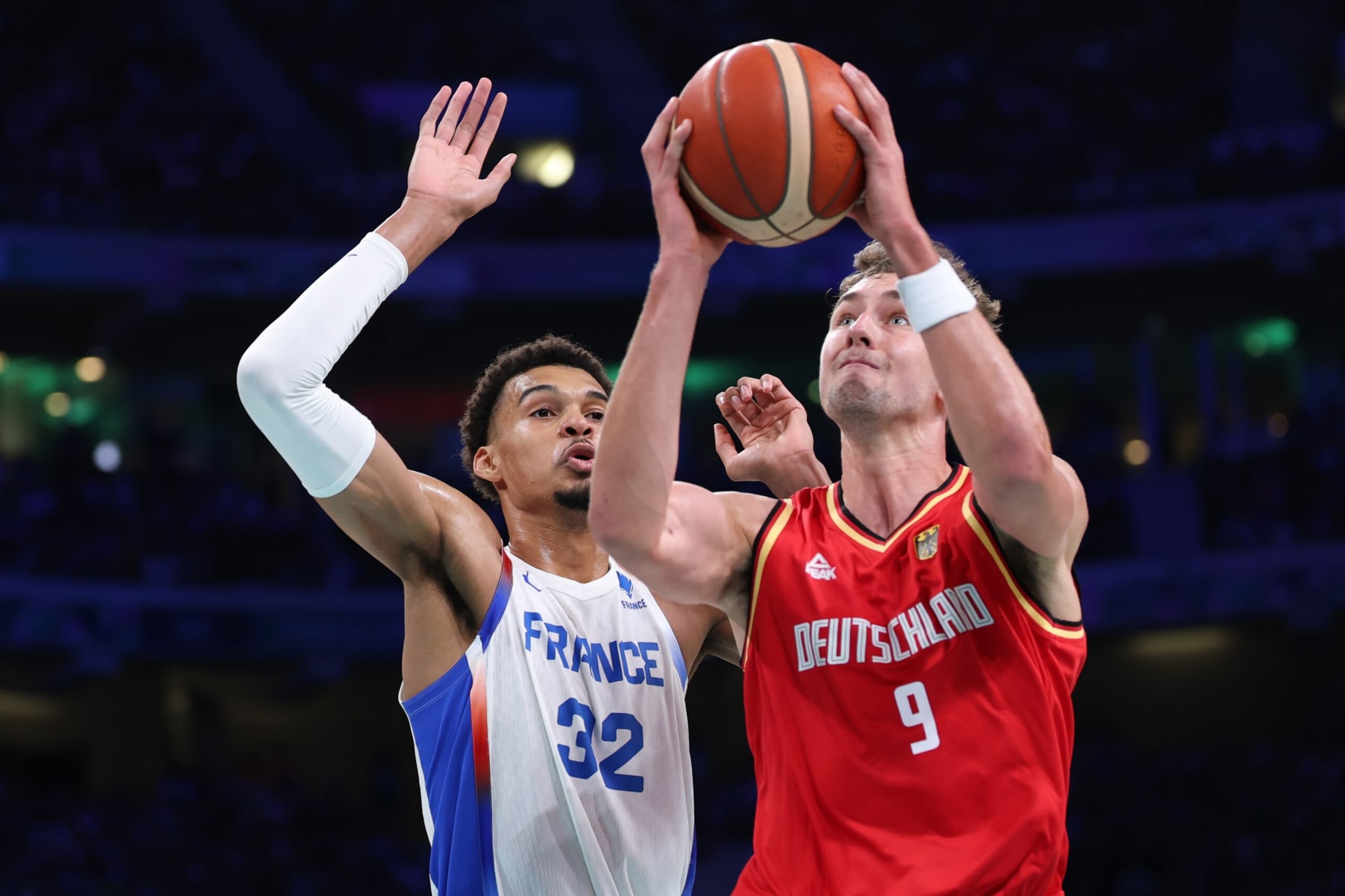 LILLE, FRANCE - AUGUST 02: Franz Wagner #9 of Team Germany goes up for a basket past Victor Wembanyama #32 of Team France during the Men's Group Phase - Group B game between Team France and Team Germany on day seven of the Olympic Games Paris 2024 at Stade Pierre Mauroy on August 02, 2024 in Lille, France. (Photo by Gregory Shamus/Getty Images)