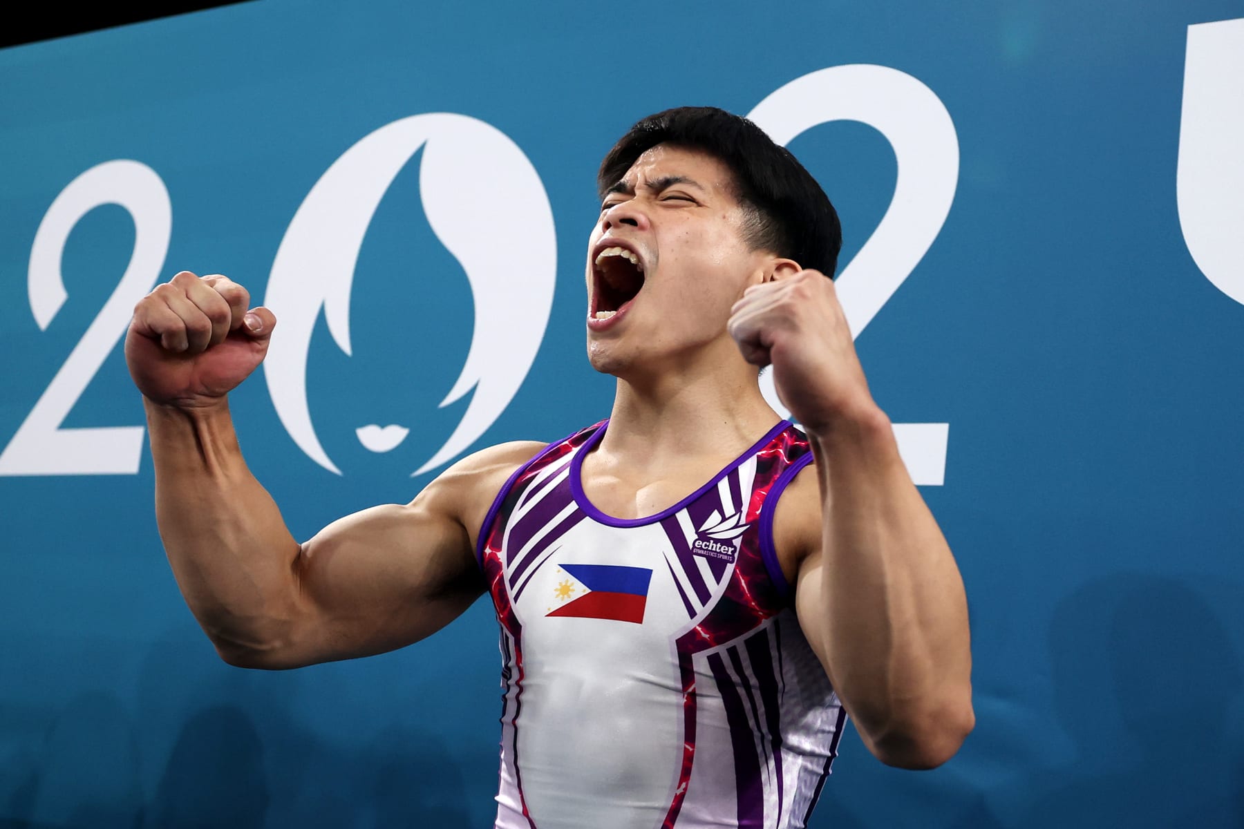 PARIS, FRANCE - AUGUST 03: Carlos Edriel Yulo of Team Philippines celebrates after finishing his routine during the Artistic Gymnastics Men's Floor Exercise Final on day eight of the Olympic Games Paris 2024 at Bercy Arena on August 03, 2024 in Paris, France. (Photo by Naomi Baker/Getty Images)
