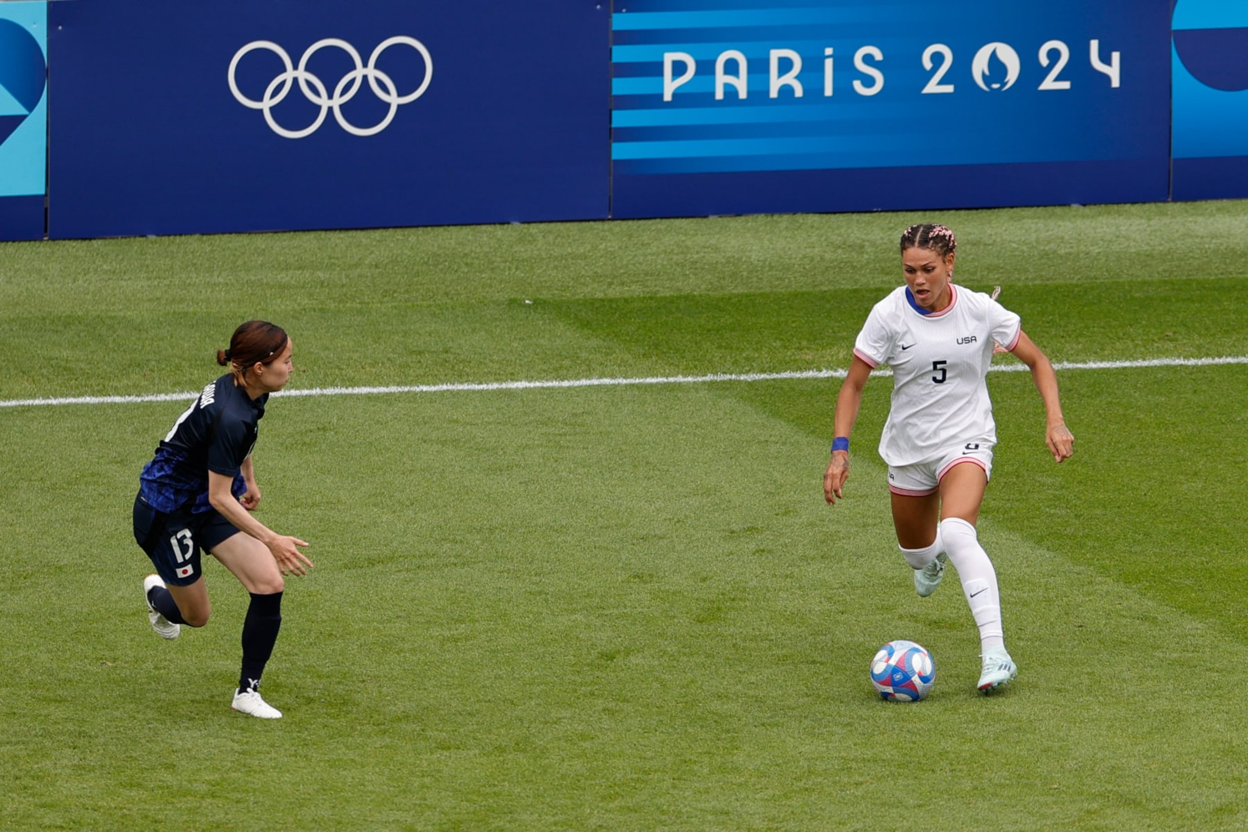 US' forward #05 Trinity Rodman (R) fights for the ball with Japan's defender #13 Hikaru Kitagawa during the women's quarter-final football match between the USA and Japan at the Paris 2024 Olympic Games at the Parc des Princes in Paris on August 3, 2024. (Photo by GEOFFROY VAN DER HASSELT / AFP) (Photo by GEOFFROY VAN DER HASSELT/AFP via Getty Images) US' forward #05 Trinity Rodman (R) fights for the ball with Japan's defender #13 Hikaru Kitagawa during the women's quarter-final football match between the USA and Japan at the Paris 2024 Olympic Games at the Parc des Princes in Paris on August 3, 2024. (Photo by GEOFFROY VAN DER HASSELT / AFP) (Photo by GEOFFROY VAN DER HASSELT/AFP via Getty Images)