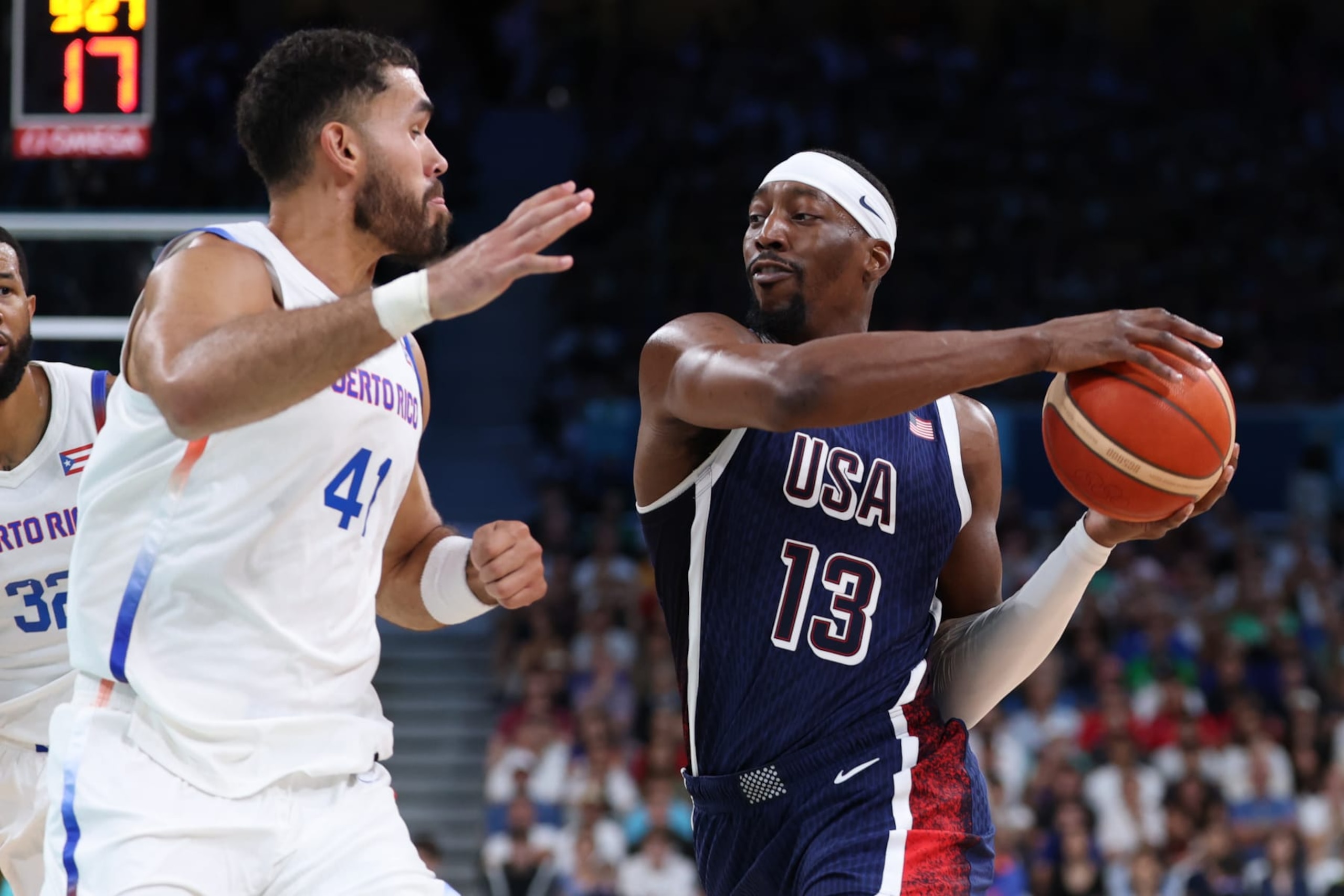LILLE, FRANCE - AUGUST 03: Arnaldo Toro #41 of Team Puerto Rico defends Bam Adebayo #13 of Team United States during a Men's basketball group phase-group C game between the United States and Puerto Rico on day eight of the Olympic Games Paris 2024 at Stade Pierre Mauroy on August 03, 2024 in Lille, France. (Photo by Gregory Shamus/Getty Images)