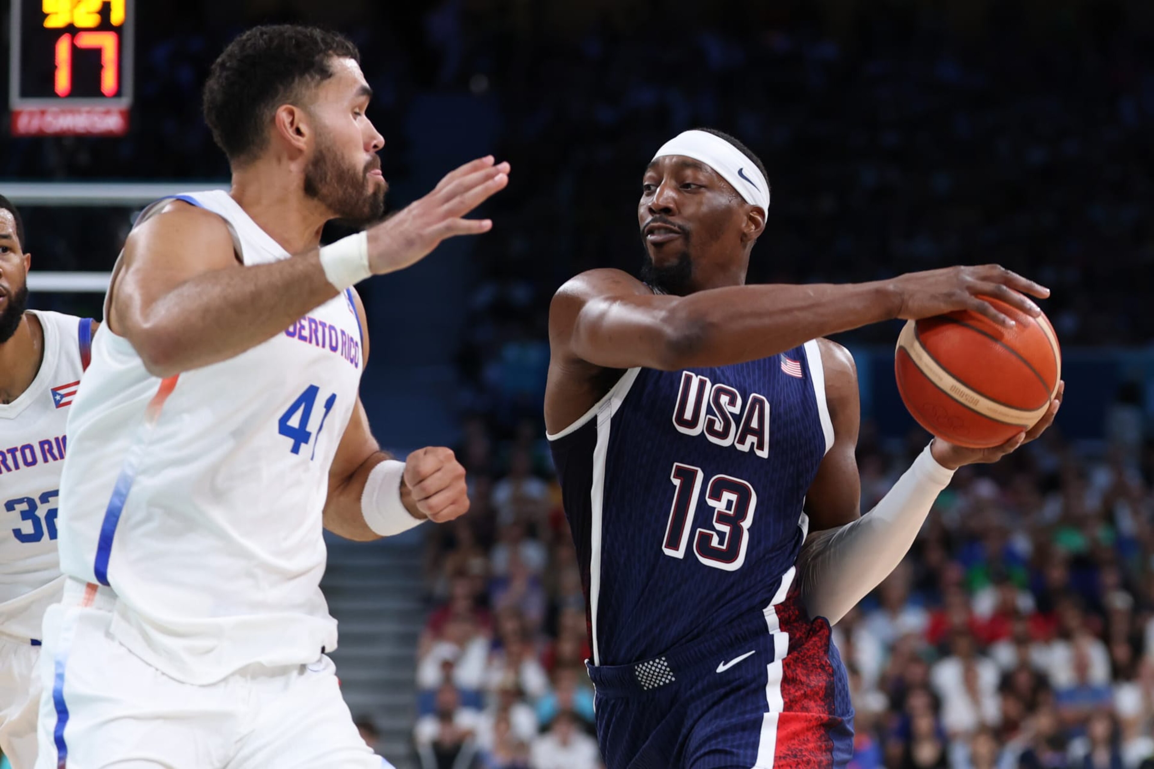 LILLE, FRANCE - AUGUST 03: Arnaldo Toro #41 of Team Puerto Rico defends Bam Adebayo #13 of Team United States during a Men's basketball group phase-group C game between the United States and Puerto Rico on day eight of the Olympic Games Paris 2024 at Stade Pierre Mauroy on August 03, 2024 in Lille, France. (Photo by Gregory Shamus/Getty Images)