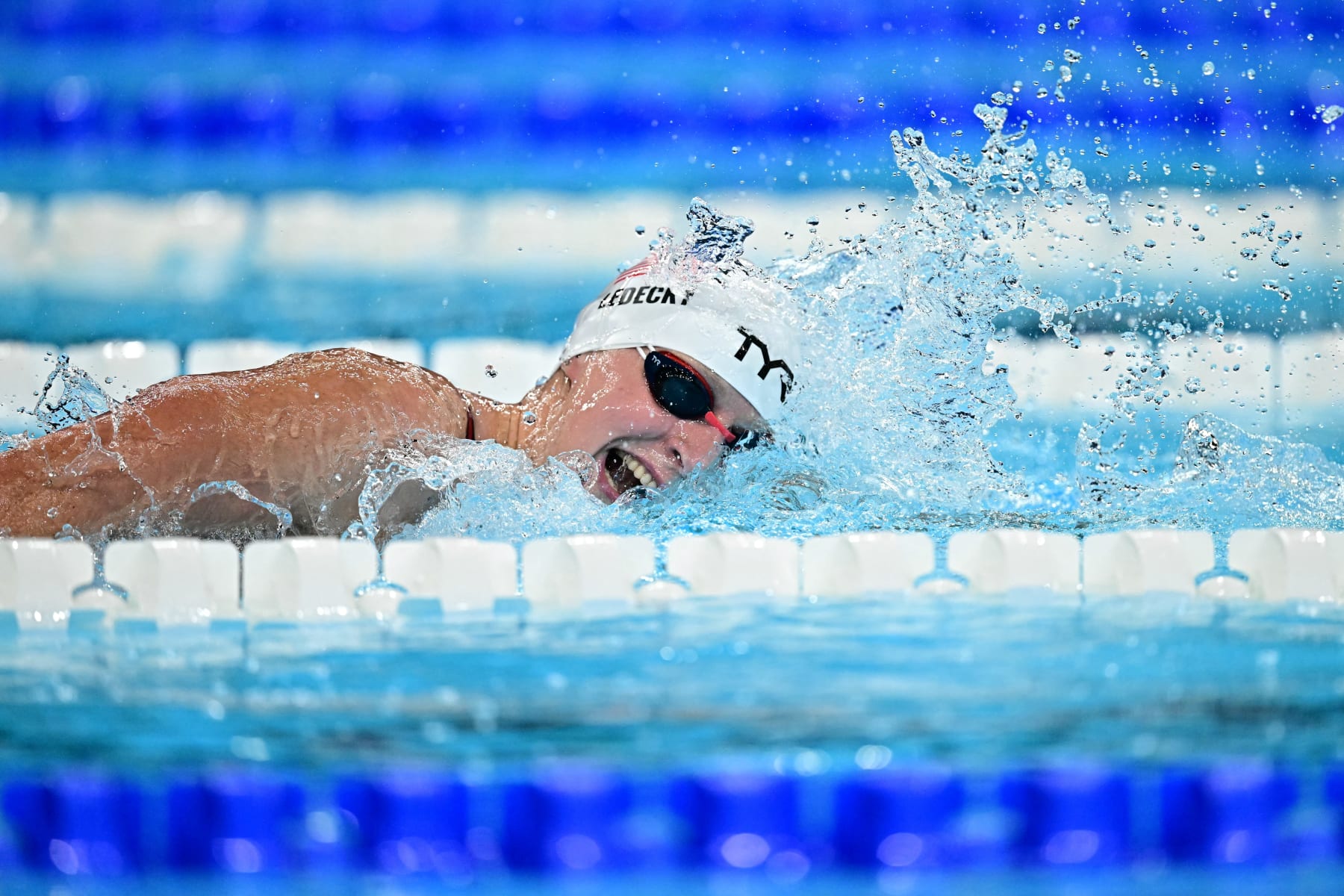 TOPSHOT - US' Katie Ledecky competes in a heat of the women's 800m freestyle swimming event during the Paris 2024 Olympic Games at the Paris La Defense Arena in Nanterre, west of Paris, on August 2, 2024. (Photo by Manan VATSYAYANA / AFP) (Photo by MANAN VATSYAYANA/AFP via Getty Images)