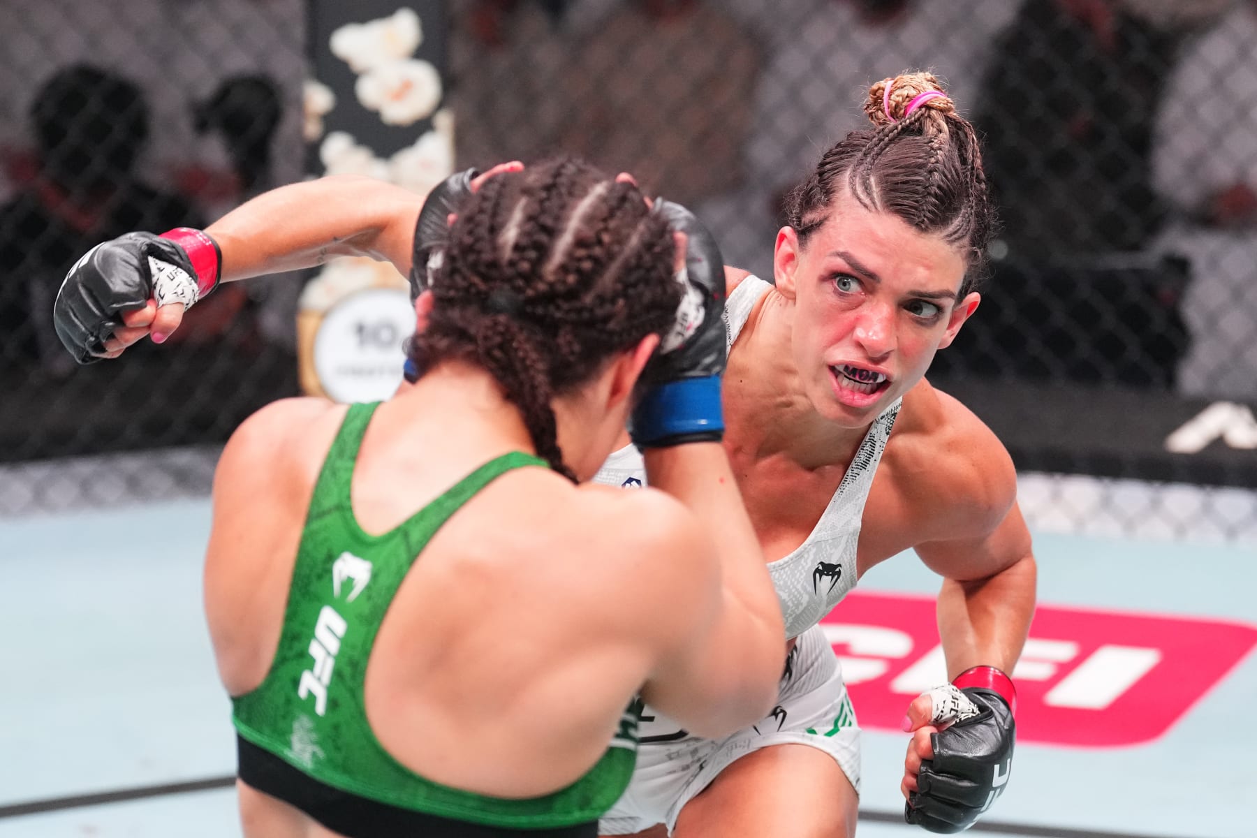 ABU DHABI, UNITED ARAB EMIRATES - AUGUST 03: (R-L) Mackenzie Dern punches Loopy Godinez of Mexico in a lightweight fight during the UFC Fight Night event at Etihad Arena on August 03, 2024 in Abu Dhabi, United Arab Emirates. (Photo by Josh Hedges/Zuffa LLC via Getty Images)
