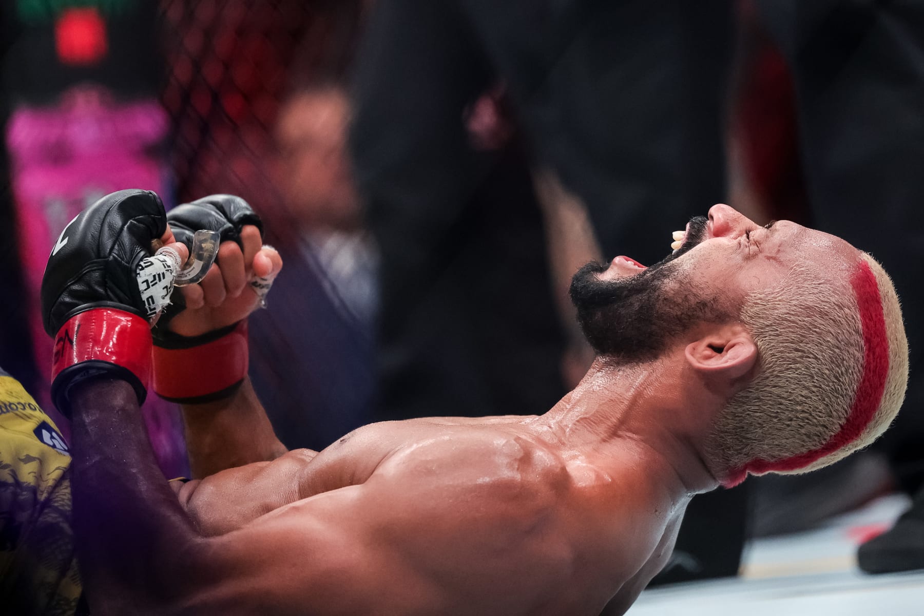LAS VEGAS, NEVADA - APRIL 13: Deiveson Figueiredo of Brazil celebrates defeating Cody Garbrandt during their bantamweight fight at T-Mobile Arena on April 13, 2024 in Las Vegas, Nevada. (Photo by Carmen Mandato/Getty Images)