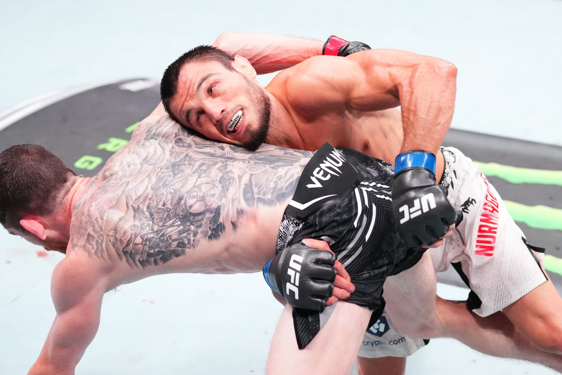 ABU DHABI, UNITED ARAB EMIRATES - AUGUST 03: Umar Nurmagomedov of Russia attempts to takedown Cory Sandhagen in a bantamweight fight during the UFC Fight Night event at Etihad Arena on August 03, 2024 in Abu Dhabi, United Arab Emirates. (Photo by Josh Hedges/Zuffa LLC via Getty Images)
