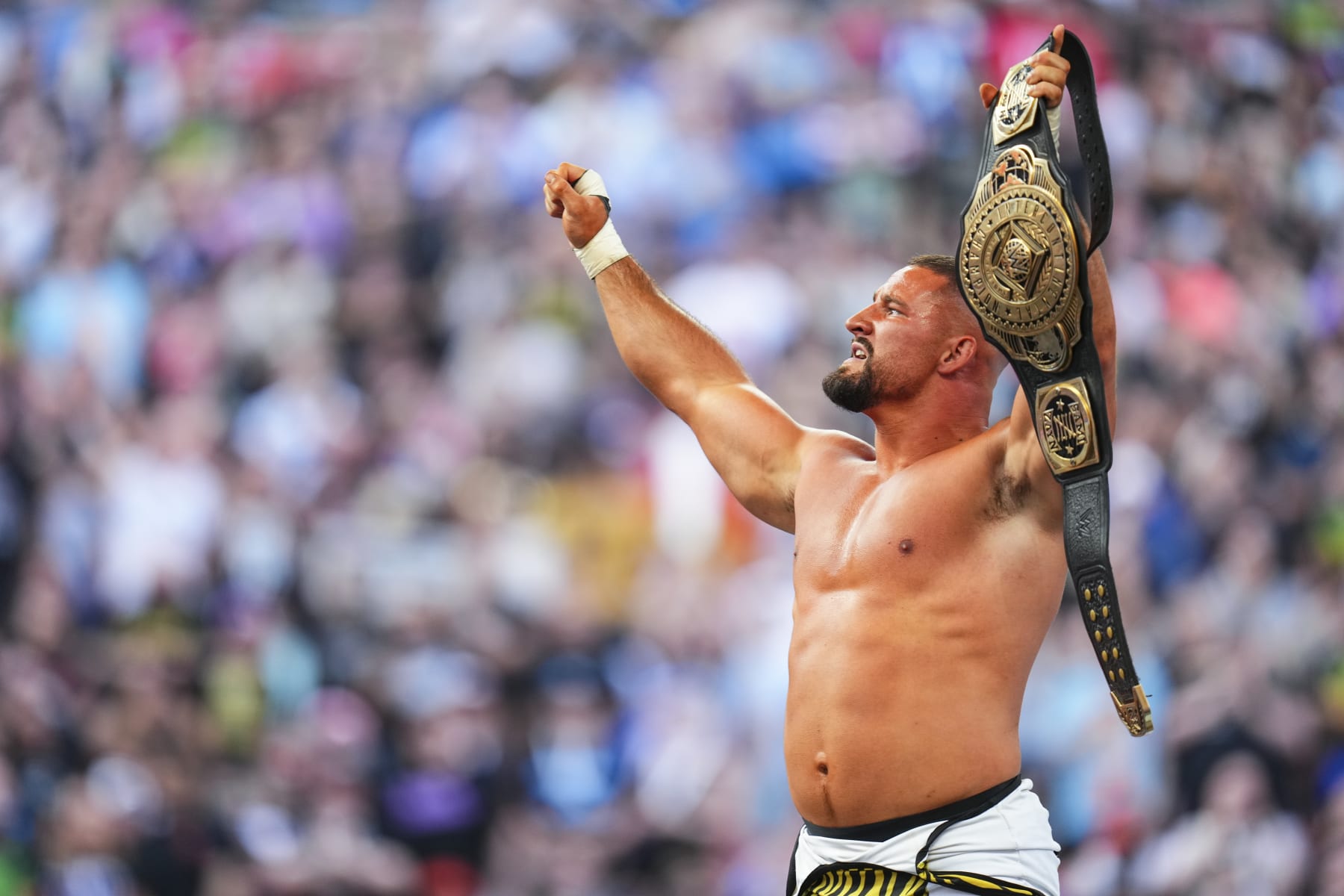 CLEVELAND, OHIO - AUGUST 3: Bron Breakker celebrates his Intercontinental Championship win during SummerSlam at Cleveland Browns Stadium on August 3, 2024 in Cleveland, Ohio.  (Photo by WWE/Getty Images)