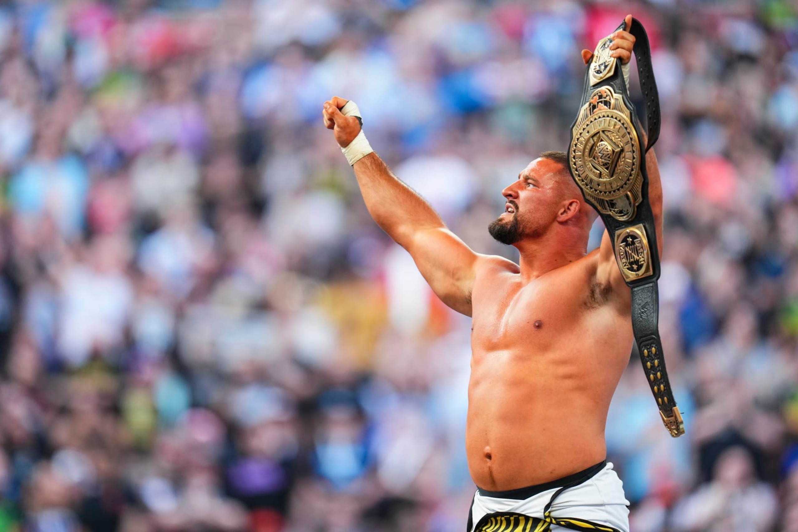 CLEVELAND, OHIO - AUGUST 3: Bron Breakker celebrates his Intercontinental Championship win during SummerSlam at Cleveland Browns Stadium on August 3, 2024 in Cleveland, Ohio.  (Photo by WWE/Getty Images)