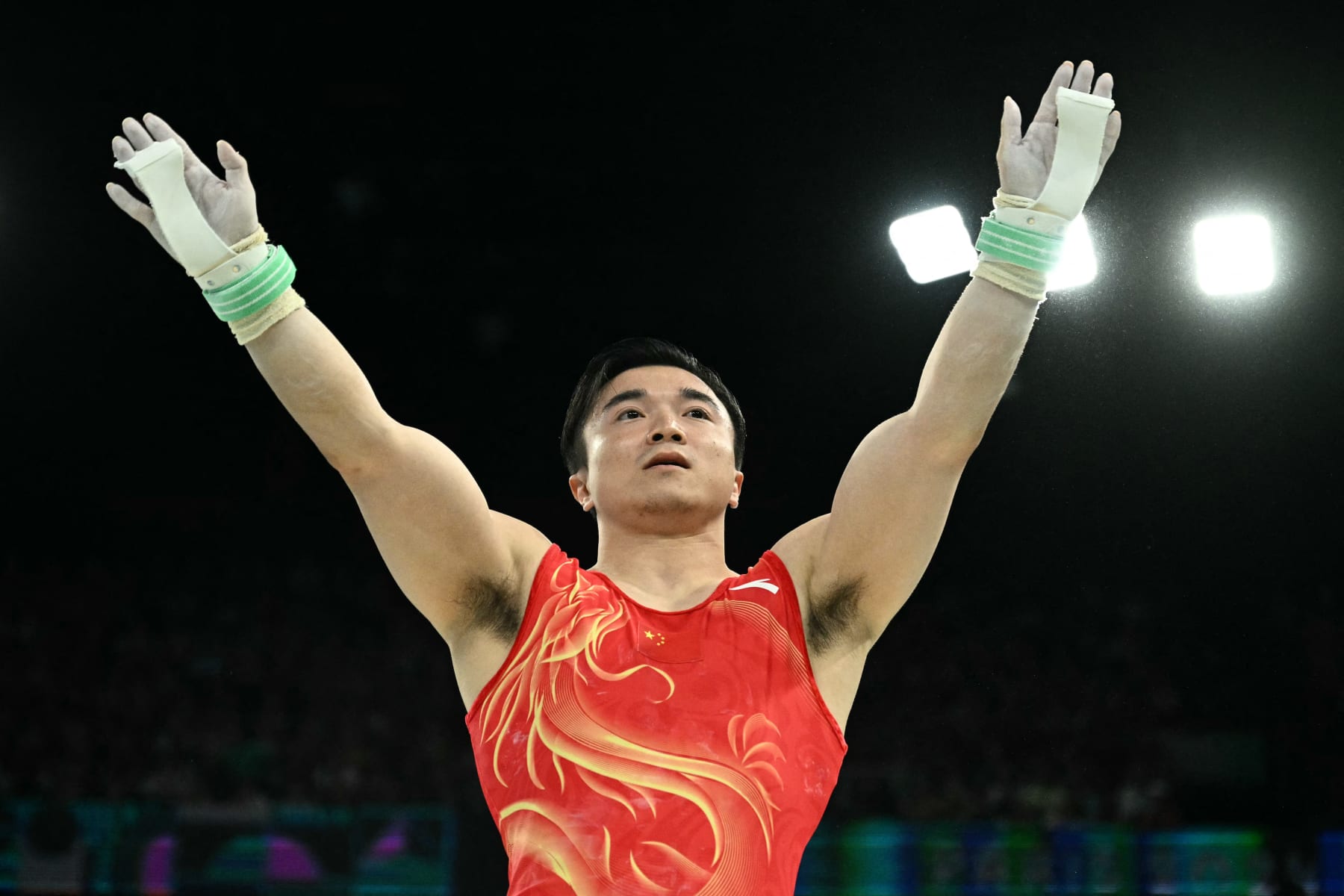 TOPSHOT - China's Liu Yang reacts after competing in the artistic gymnastics men's rings final during the Paris 2024 Olympic Games at the Bercy Arena in Paris, on August 4, 2024. (Photo by Lionel BONAVENTURE / AFP) (Photo by LIONEL BONAVENTURE/AFP via Getty Images)