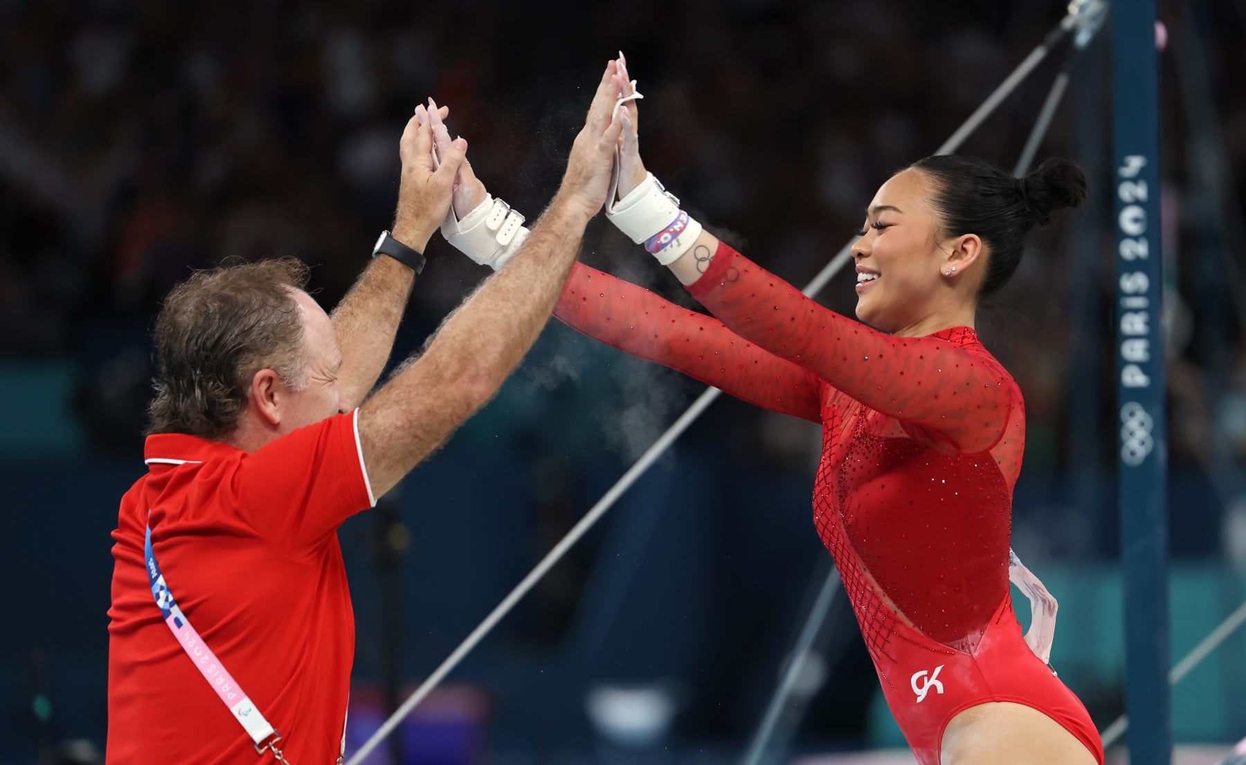 PARIS, FRANCE - AUGUST 04: Sunisa Lee of Team United States reacts after finishing her routine during the Artistic Gymnastics Women's Uneven Bars Final on day nine of the Olympic Games Paris 2024 at Bercy Arena on August 04, 2024 in Paris, France. (Photo by Luke Hales/Getty Images)