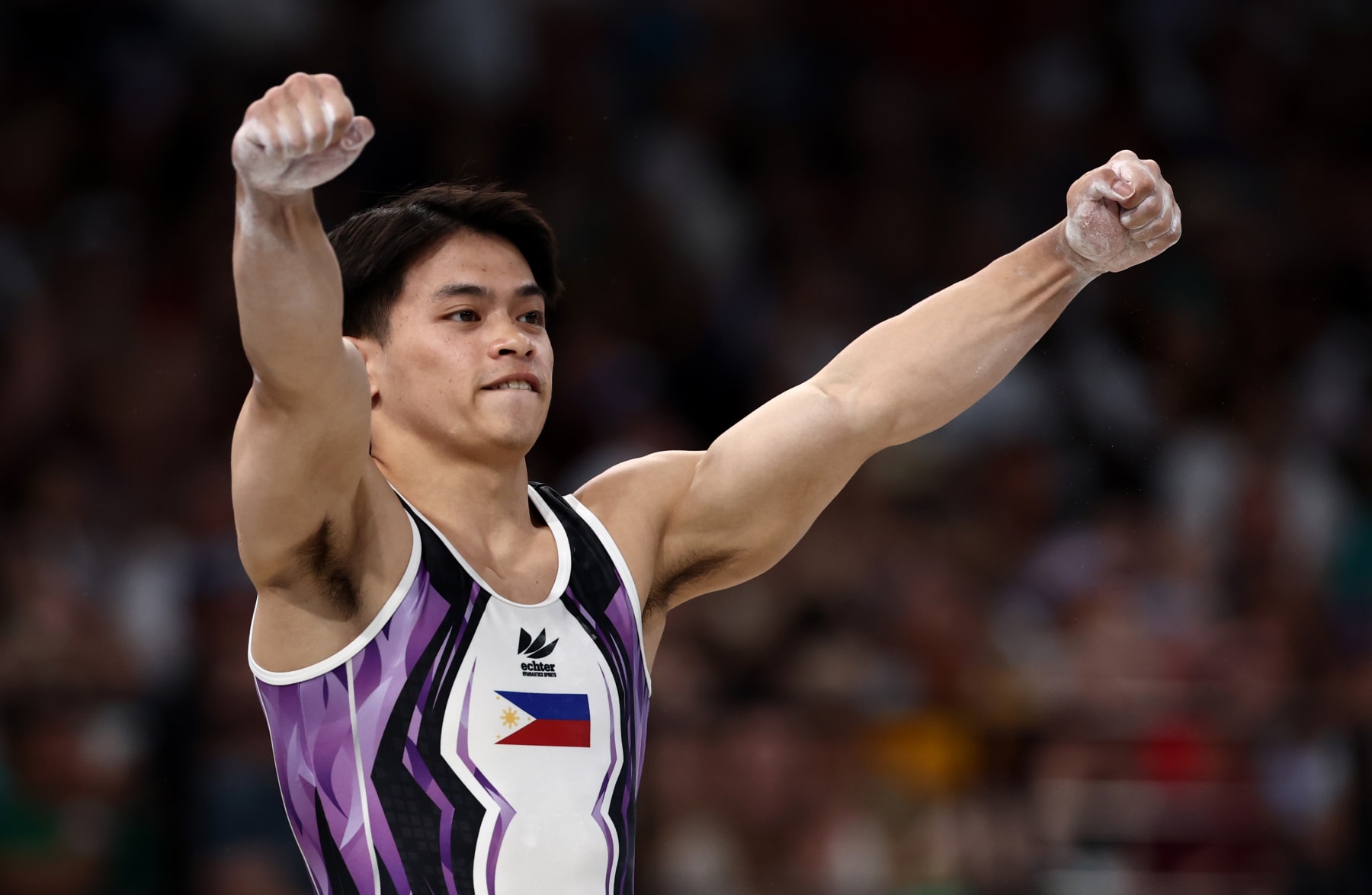 PARIS, FRANCE - AUGUST 04: Carlos Edriel Yulo of Team Philippines reacts after finishing his routine during the Artistic Gymnastics Men's Vault Final on day nine of the Olympic Games Paris 2024 at Bercy Arena on August 04, 2024 in Paris, France. (Photo by Naomi Baker/Getty Images)