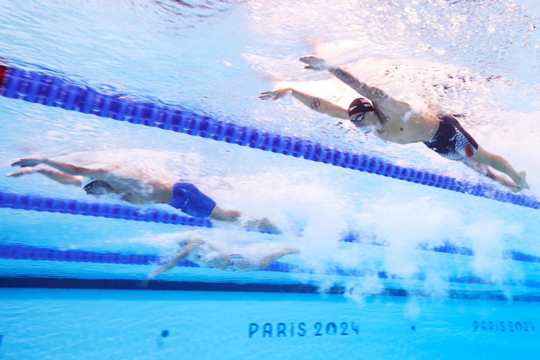 NANTERRE, FRANCE - AUGUST 02: (EDITORS NOTE: Image was captured using an underwater robotic camera.) Caeleb Dressel of Team United States competes in the Men's 100m Butterfly Semifinals on day seven of the Olympic Games Paris 2024 at Paris La Defense Arena on August 02, 2024 in Nanterre, France. (Photo by Adam Pretty/Getty Images)