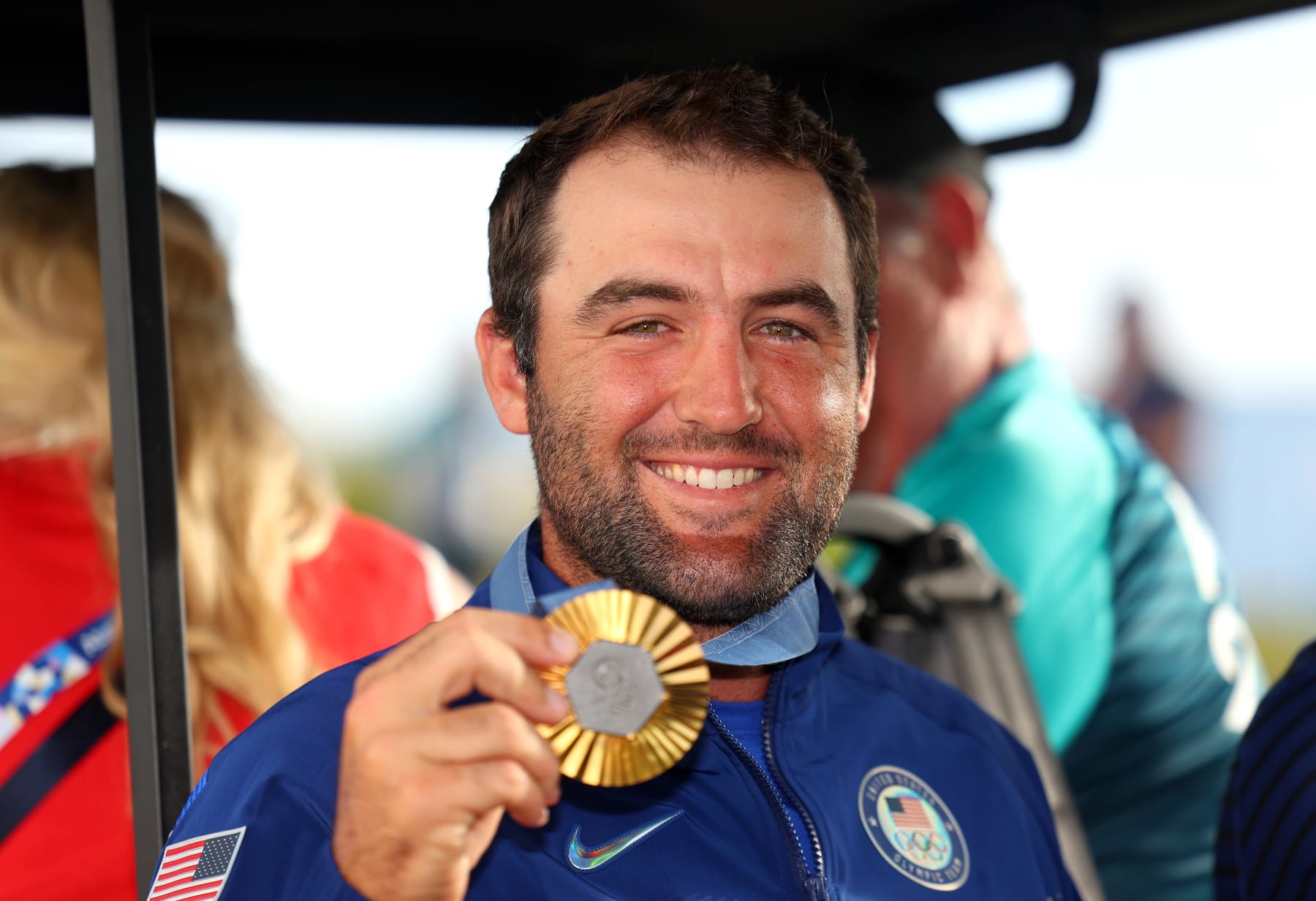 PARIS, FRANCE - AUGUST 04: Gold medalist, Scottie Scheffler of Team United States poses with his medal following Day Four of the Men's Individual Stroke Play on day nine of the Olympic Games Paris 2024 at Le Golf National on August 04, 2024 in Paris, France. (Photo by Andrew Redington/Getty Images)