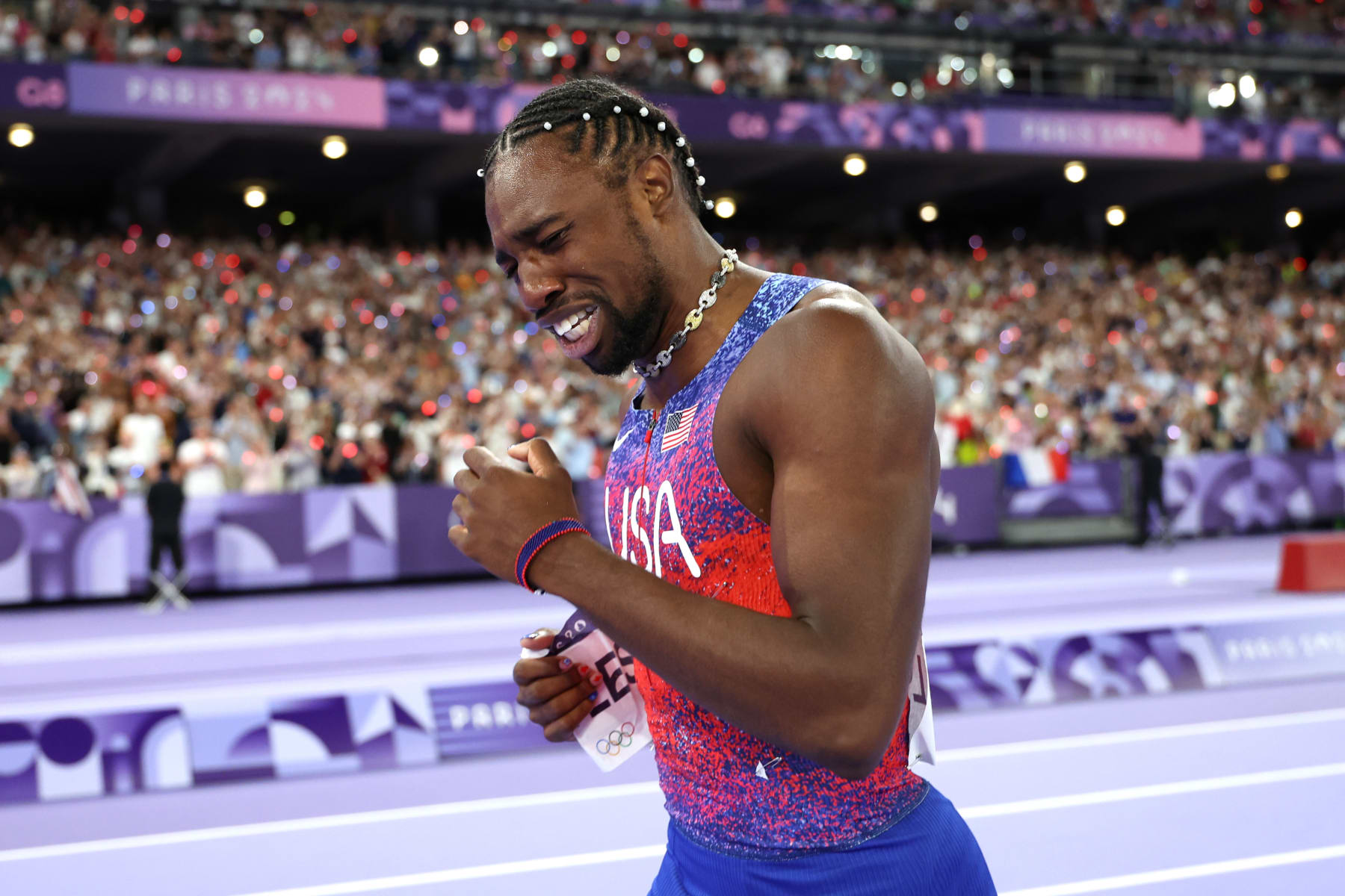 PARIS, FRANCE - AUGUST 04: Noah Lyles of Team United States celebrates winning the gold medal after competing the Men's 100m Final on day nine of the Olympic Games Paris 2024 at Stade de France on August 04, 2024 in Paris, France. (Photo by Christian Petersen/Getty Images)