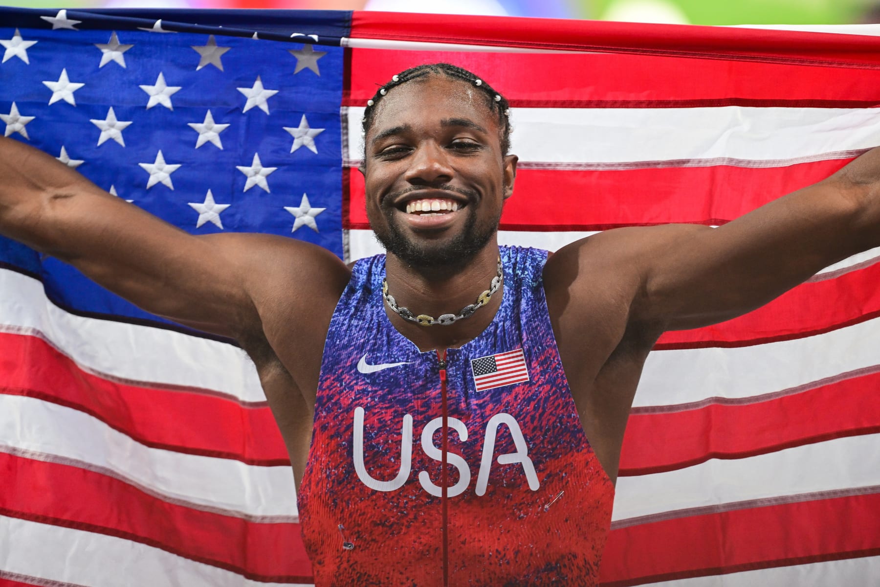 SAINT-DENIS, FRANCE - AUGUST 04: US' Noah Lyles celebrates after winning the men's 100m final of the athletics event at the Paris 2024 Olympic Games at Stade de France in Saint-Denis, north of Paris, on August 4, 2024. (Photo by Mehmet Murat Onel/Anadolu via Getty Images)