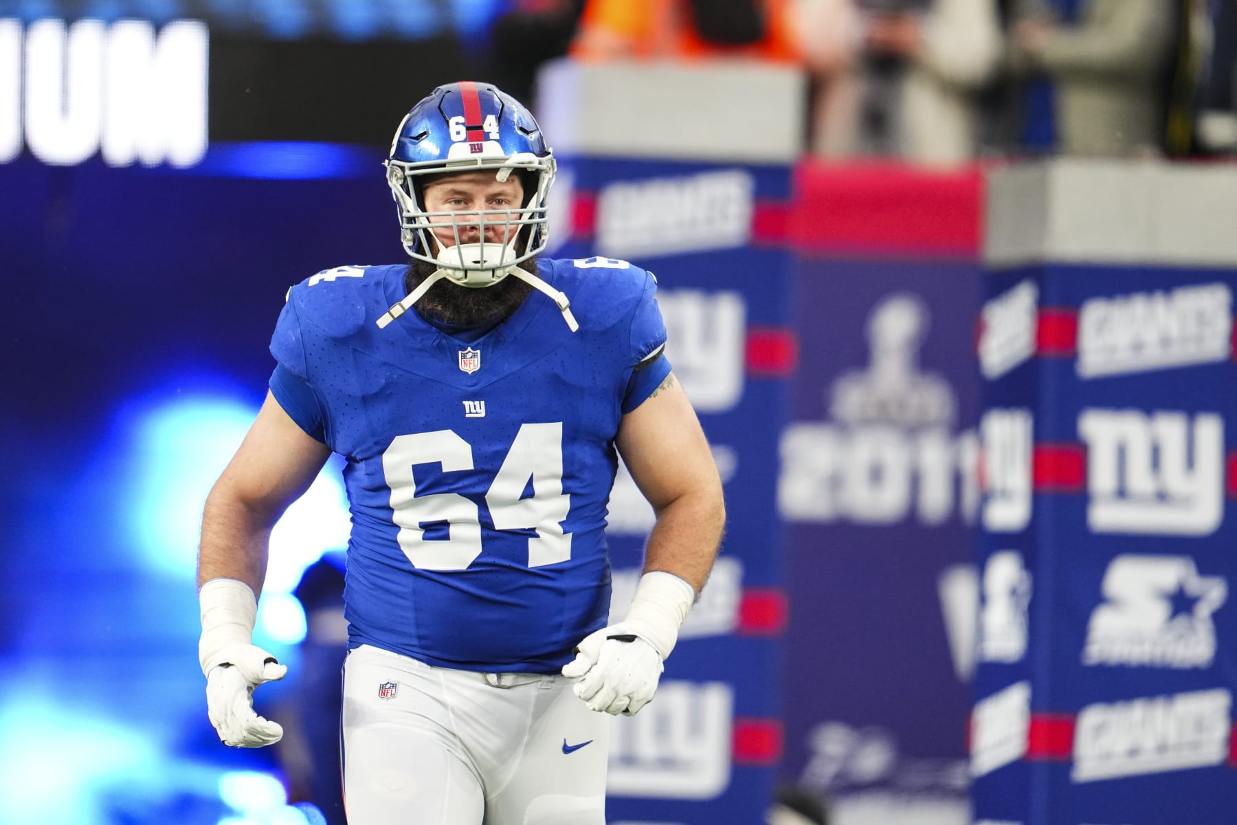 EAST RUTHERFORD, NJ - JANUARY 07: Mark Glowinski #64 of the New York Giants runs out of the tunnel prior to an NFL football game against the Philadelphia Eagles at MetLife Stadium on January 7, 2024 in East Rutherford, New Jersey. (Photo by Cooper Neill/Getty Images)