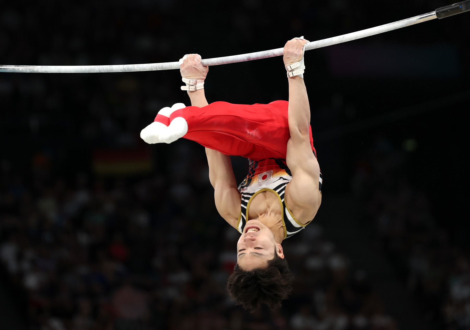 PARIS, FRANCE - AUGUST 05: Shinnosuke Oka of Team Japan reacts after competing in the Artistic Gymnastics Men's Horizontal Bar Final on day ten of the Olympic Games Paris 2024 at Bercy Arena on August 05, 2024 in Paris, France. (Photo by Jamie Squire/Getty Images)