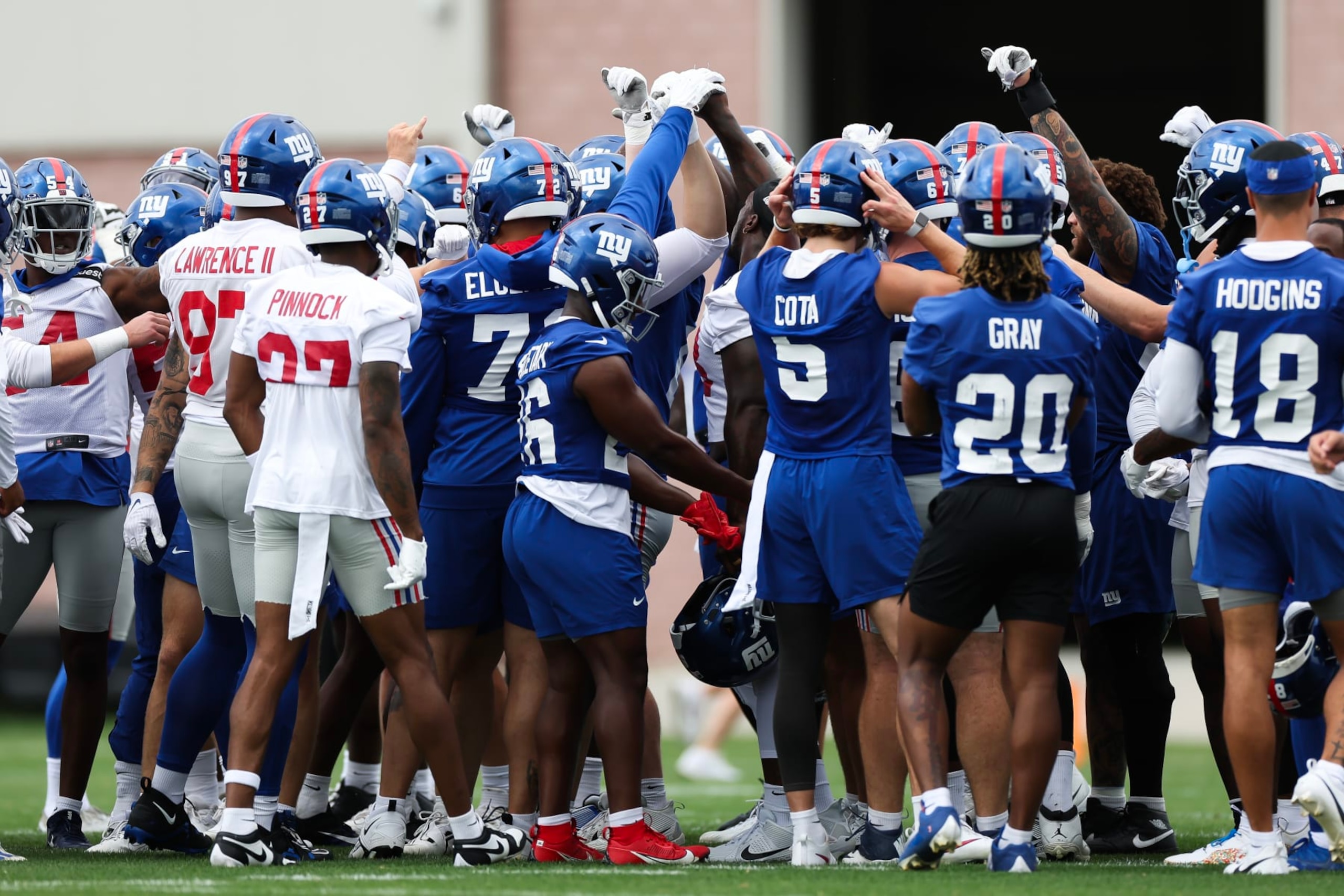 EAST RUTHERFORD, NEW JERSEY - JUNE 06: The New York Giants huddle during New York Giants OTA Offseason Workouts at NY Giants Quest Diagnostics Training Center on June 06, 2024 in East Rutherford, New Jersey.  (Photo by Luke Hales/Getty Images)