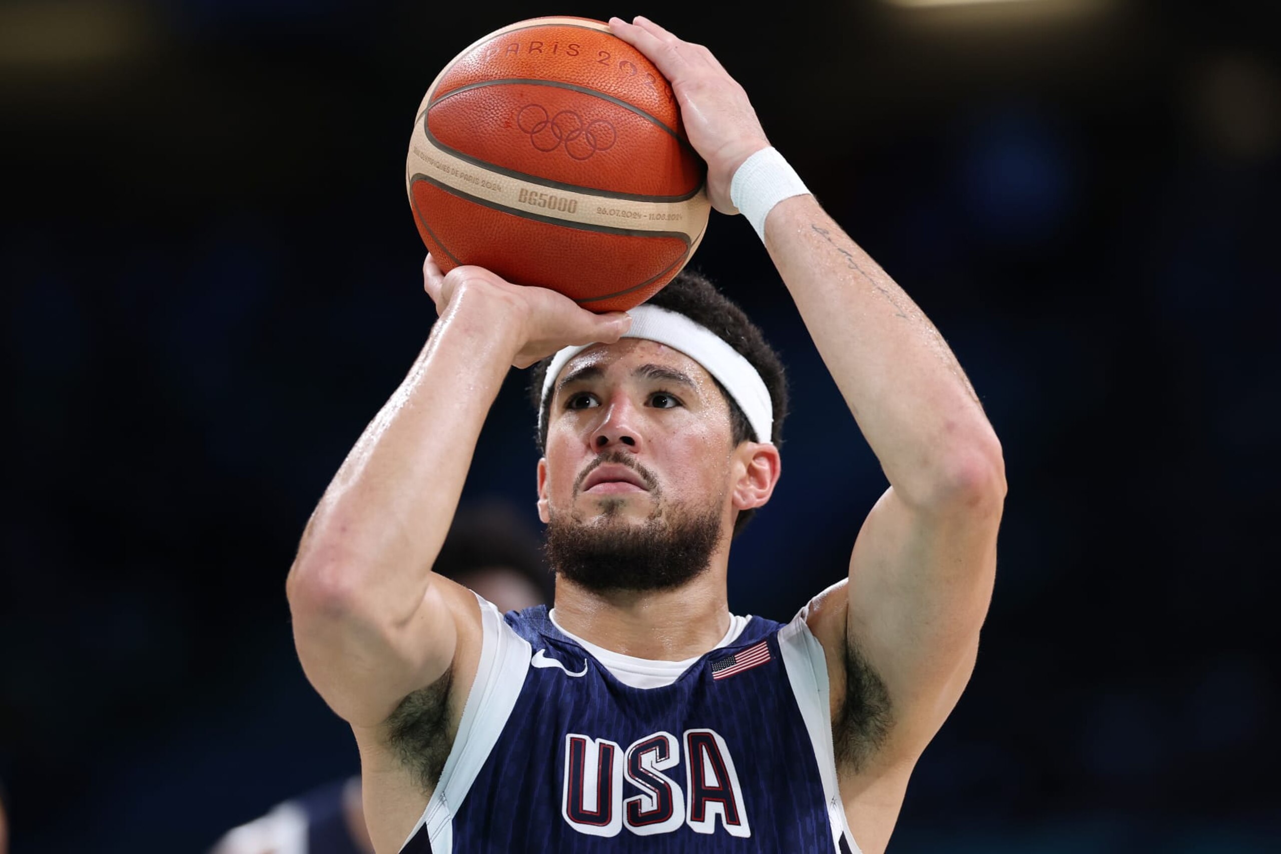 LILLE, FRANCE - AUGUST 03: Devin Booker #15 of Team United States shoots during a Men's basketball group phase-group C game between the United States and Puerto Rico on day eight of the Olympic Games Paris 2024 at Stade Pierre Mauroy on August 03, 2024 in Lille, France. (Photo by Gregory Shamus/Getty Images)