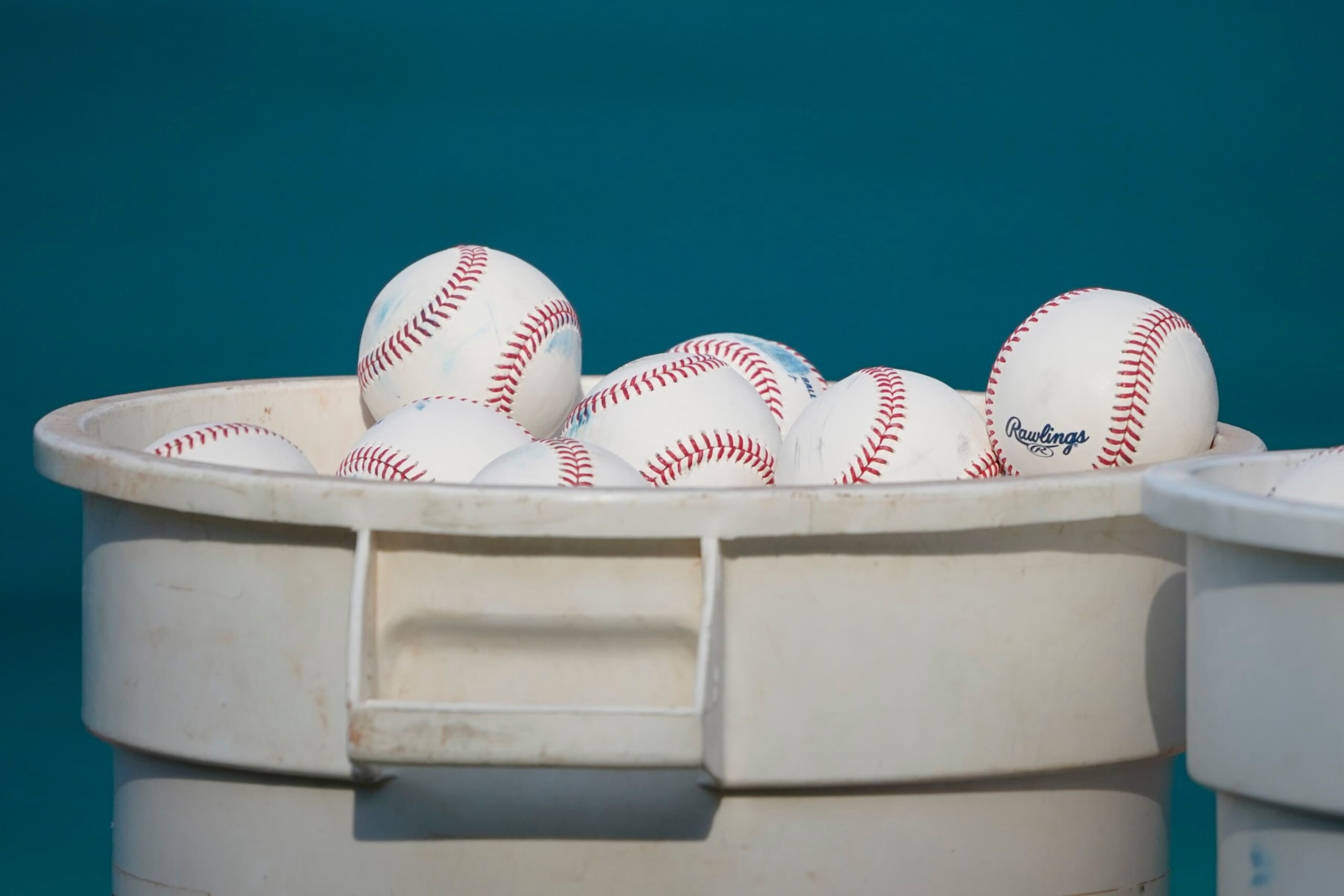 KANSAS CITY, MISSOURI - AUGUST 01: Buckets of Rawlings baseballs sit on the field at Kauffman Stadium on August 01, 2023 in Kansas City, Missouri. (Photo by Ed Zurga/Getty Images)