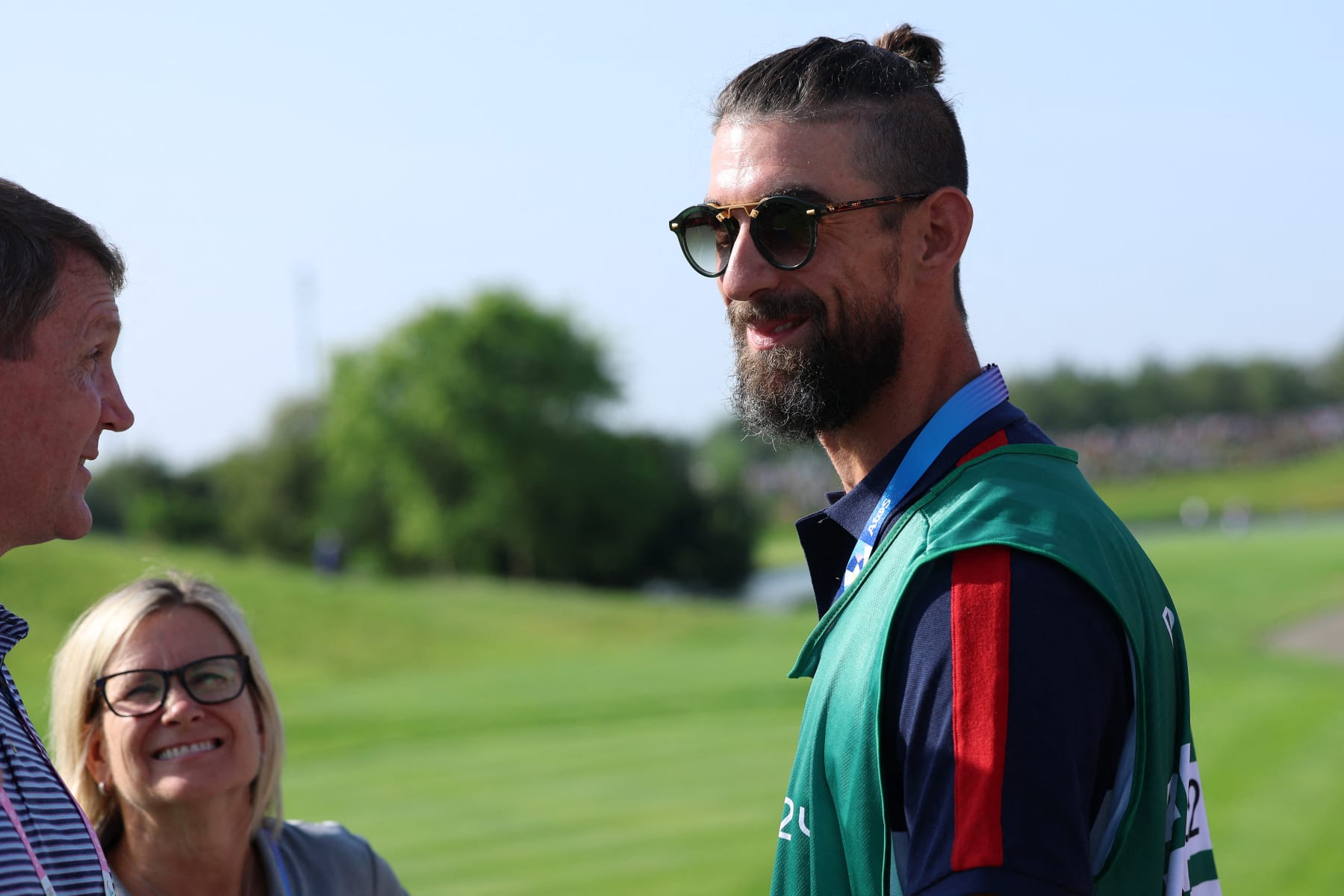Former US swimmer Michael Phelps attends the men's golf individual stroke play of the Paris 2024 Olympic Games at Le Golf National in Guyancourt, south-west of Paris on August 1, 2024. (Photo by Emmanuel DUNAND / AFP) (Photo by EMMANUEL DUNAND/AFP via Getty Images)