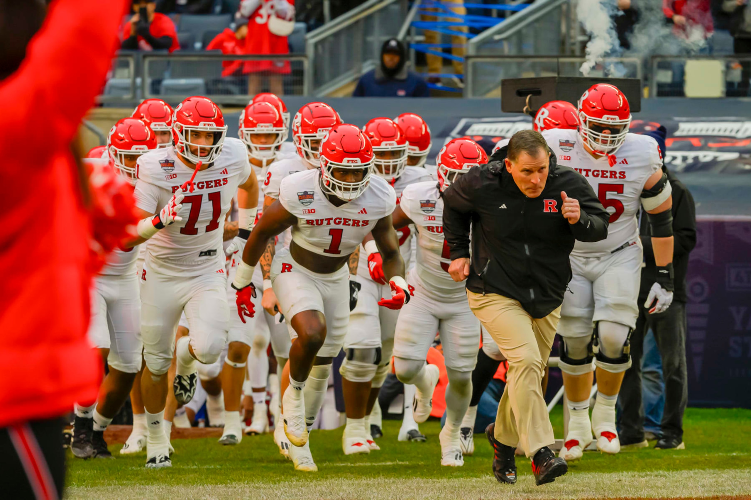 NEW YORK, NEW YORK - DECEMBER 28: Rutgers Head Coach Greg Schiano leads his team on the field before a game between Rutgers University and University of Miami at Yankee Stadium on December 28, 2023 in New York, New York. (Photo by James Patrick Cooper/ISI Photos/Getty Images)