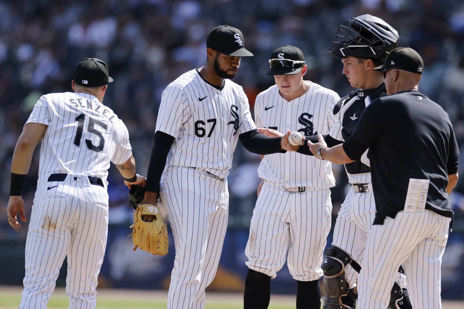 CHICAGO, IL - JULY 31: Chicago White Sox pitcher Sammy Peralta (67) hands the ball to manager Pedro Grifol (5) after giving up four runs in the ninth inning during an MLB game against the Kansas City Royals on July 31, 2024 at Guaranteed Rate Field in Chicago, Illinois. (Photo by Joe Robbins/Icon Sportswire via Getty Images)