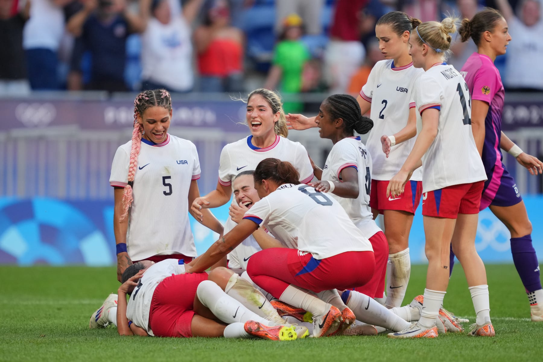 LYON, FRANCE - AUGUST 06: Sophia Smith #11 of the United States celebrates scoring with teammates during extra time against Germany during the Women's semifinal match during the Olympic Games Paris 2024 at Stade de Lyon on August 06, 2024 in Lyon, France. (Photo by John Todd/ISI/Getty Images)