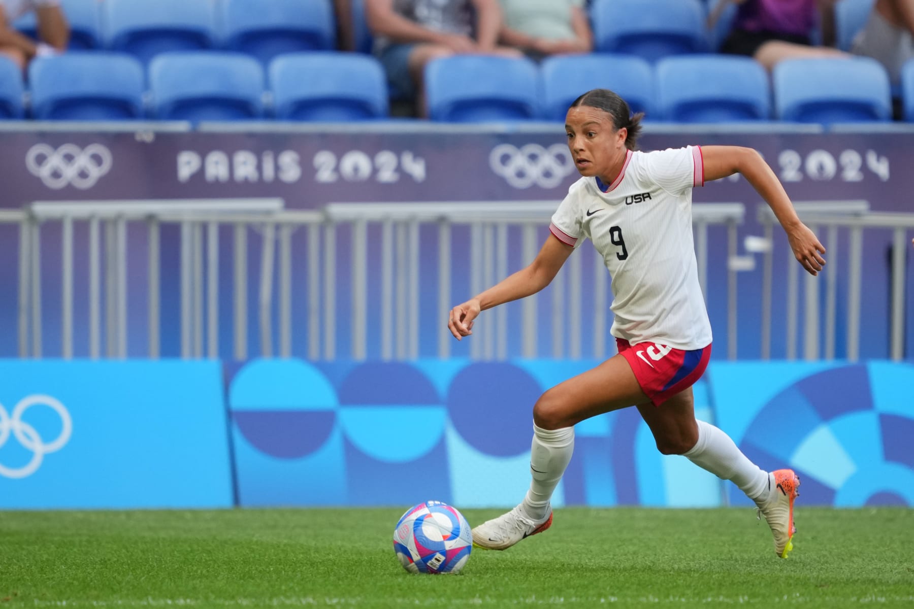 LYON, FRANCE - AUGUST 06: Mallory Swanson #9 of the United States advances the ball during the first half against Germany during the Women's semifinal match during the Olympic Games Paris 2024 at Stade de Lyon on August 06, 2024 in Lyon, France. (Photo by John Todd/ISI/Getty Images)