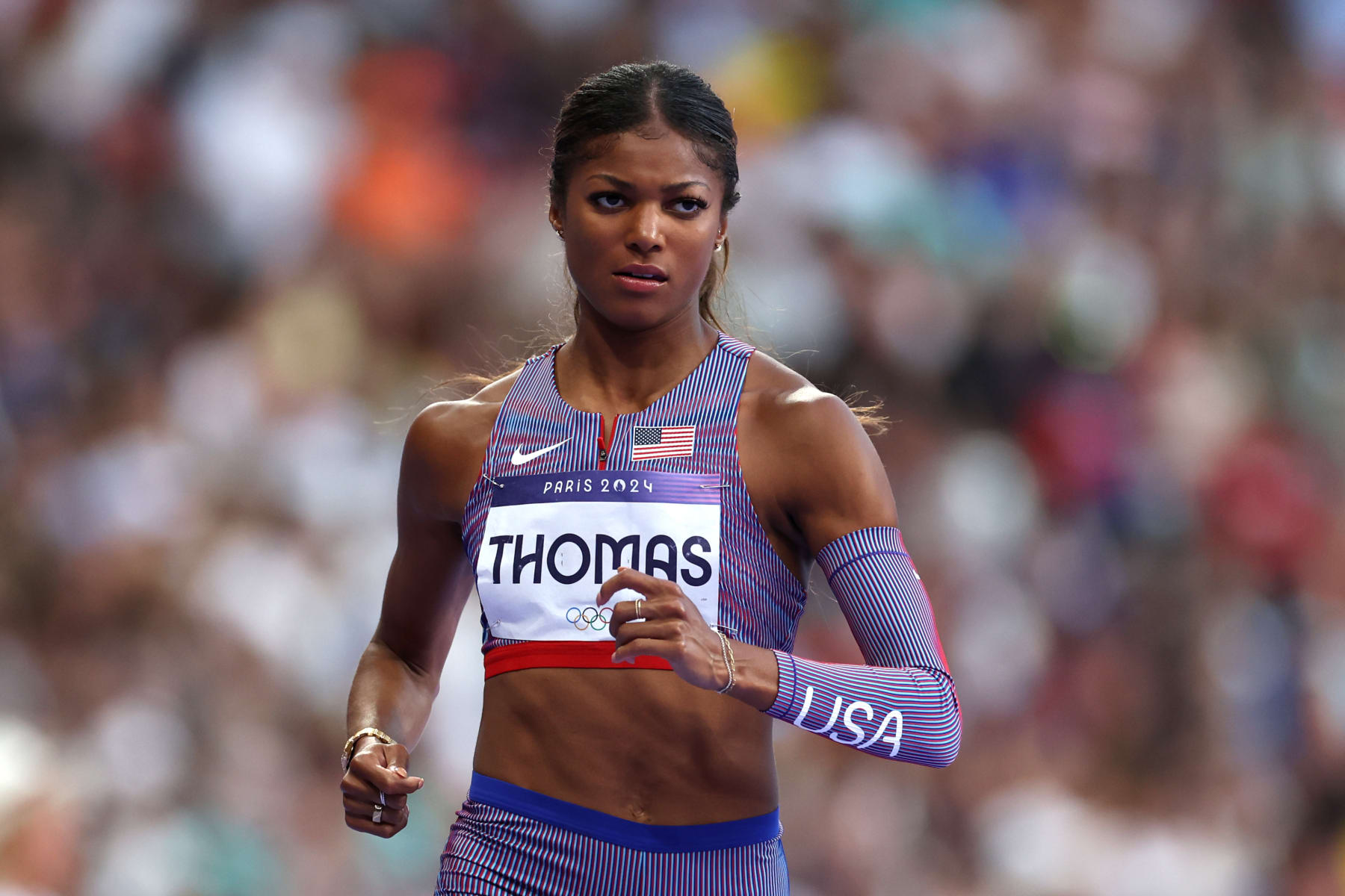 PARIS, FRANCE - AUGUST 05: Gabrielle Thomas of Team United States competes during Women's 200m Semi-Final on day ten of the Olympic Games Paris 2024 at Stade de France on August 05, 2024 in Paris, France. (Photo by Cameron Spencer/Getty Images)