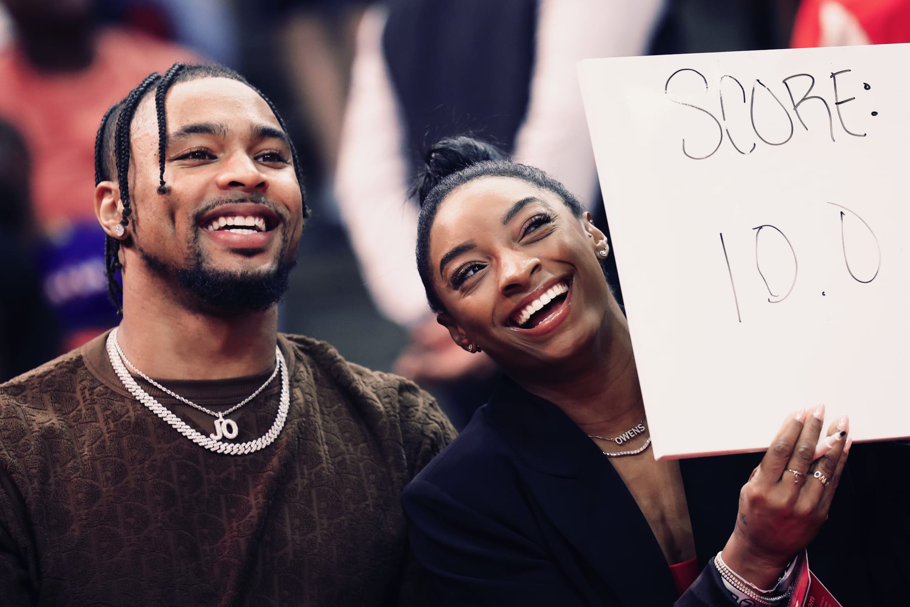 HOUSTON, TEXAS - JANUARY 29: Simone Biles and Jonathan Owens attend a game between the Houston Rockets and the Los Angeles Lakers at Toyota Center on January 29, 2024 in Houston, Texas. NOTE TO USER: User expressly acknowledges and agrees that, by downloading and or using this photograph, User is consenting to the terms and conditions of the Getty Images License Agreement.  (Photo by Carmen Mandato/Getty Images)