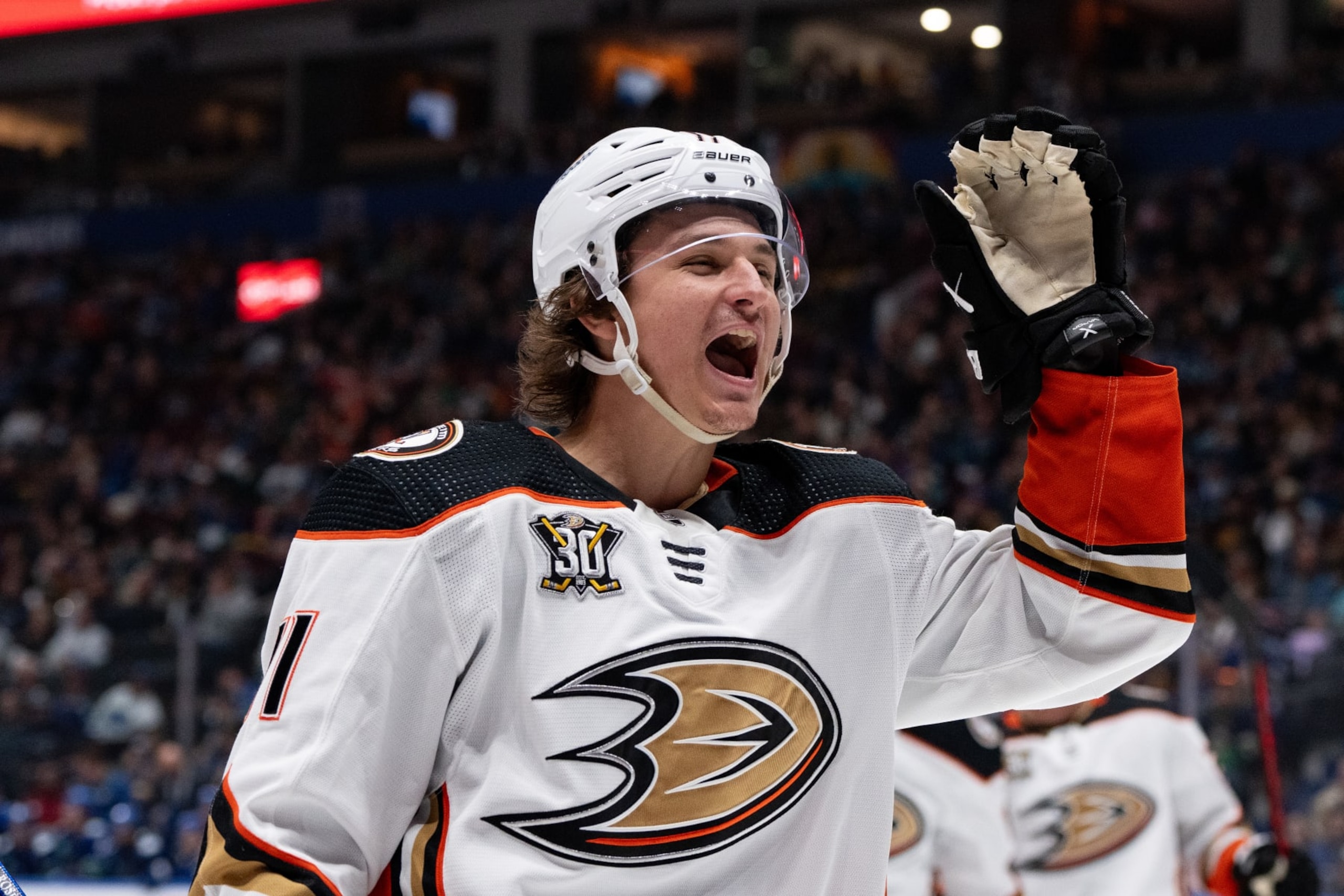 VANCOUVER, CANADA - MARCH 31: Trevor Zegras #11 of the Anaheim Ducks celebrates Mason McTavish's #23 goal against the Vancouver Canucks during the third period of their NHL Game at Rogers Arena on March 31, 2024 in Vancouver, British Columbia, Canada. (Photo by Ethan Cairns/Getty Images)