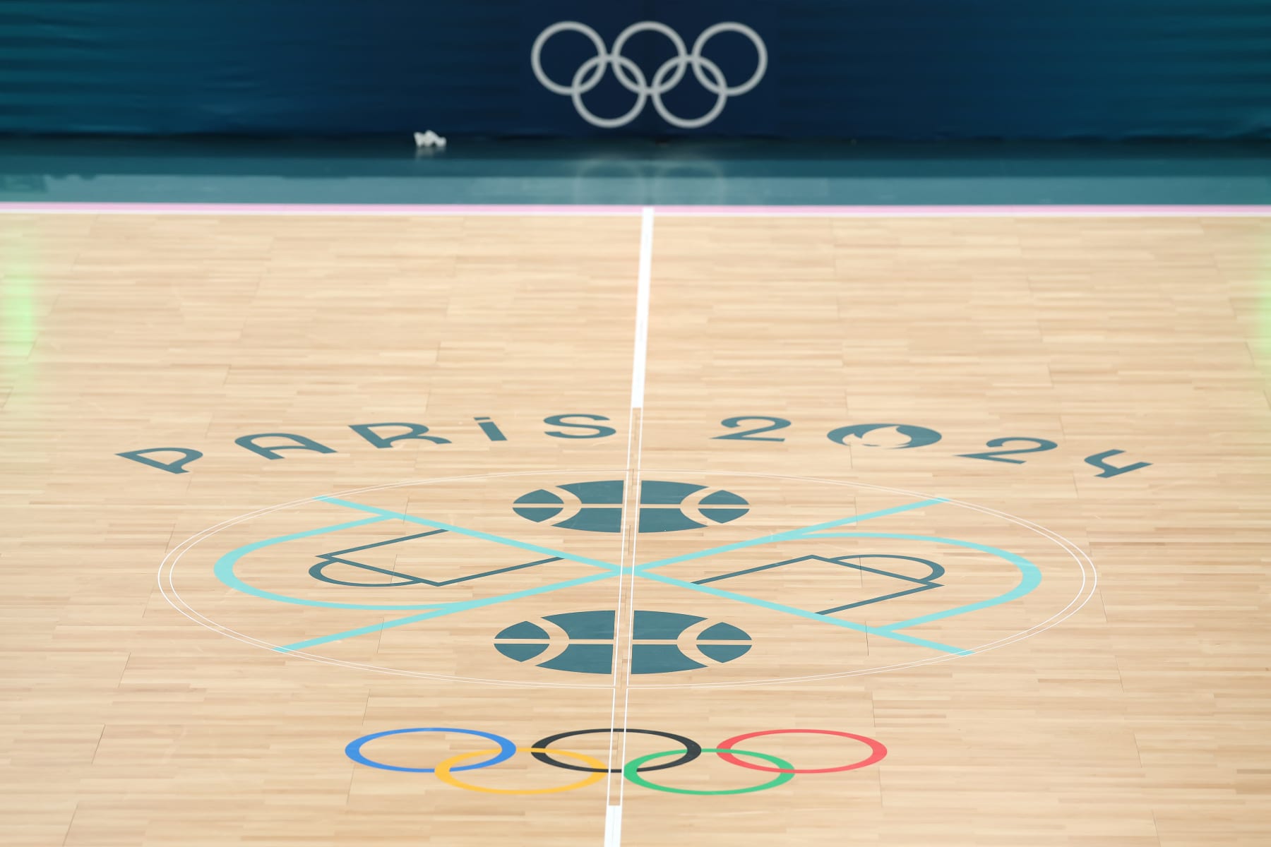 PARIS, FRANCE - AUGUST 06: A view of the Olympic logo on center court during a Men's basketball quarterfinal game between Team United States and Team Brazil on day eleven of the Olympic Games Paris 2024 at Bercy Arena on August 06, 2024 in Paris, France. (Photo by Michael Reaves/Getty Images)