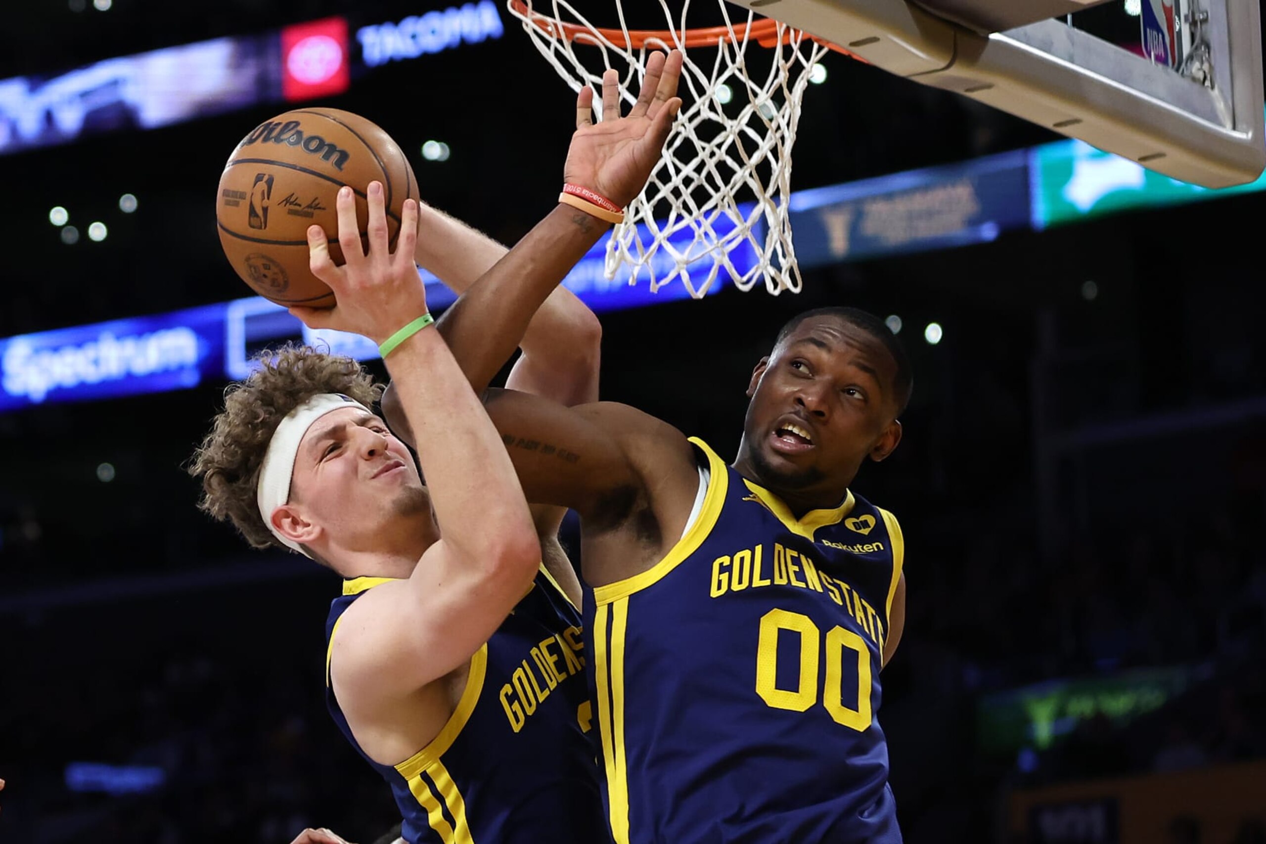LOS ANGELES, CALIFORNIA - MARCH 16: Brandin Podziemski #2 and Jonathan Kuminga #00 of the Golden State Warriors get tangled while rebounding during the second half of a game against the Los Angeles Lakers at Crypto.com Arena on March 16, 2024 in Los Angeles, California. NOTE TO USER: User expressly acknowledges and agrees that, by downloading and or using this photograph, User is consenting to the terms and conditions of the Getty Images License Agreement. (Photo by Sean M. Haffey/Getty Images)