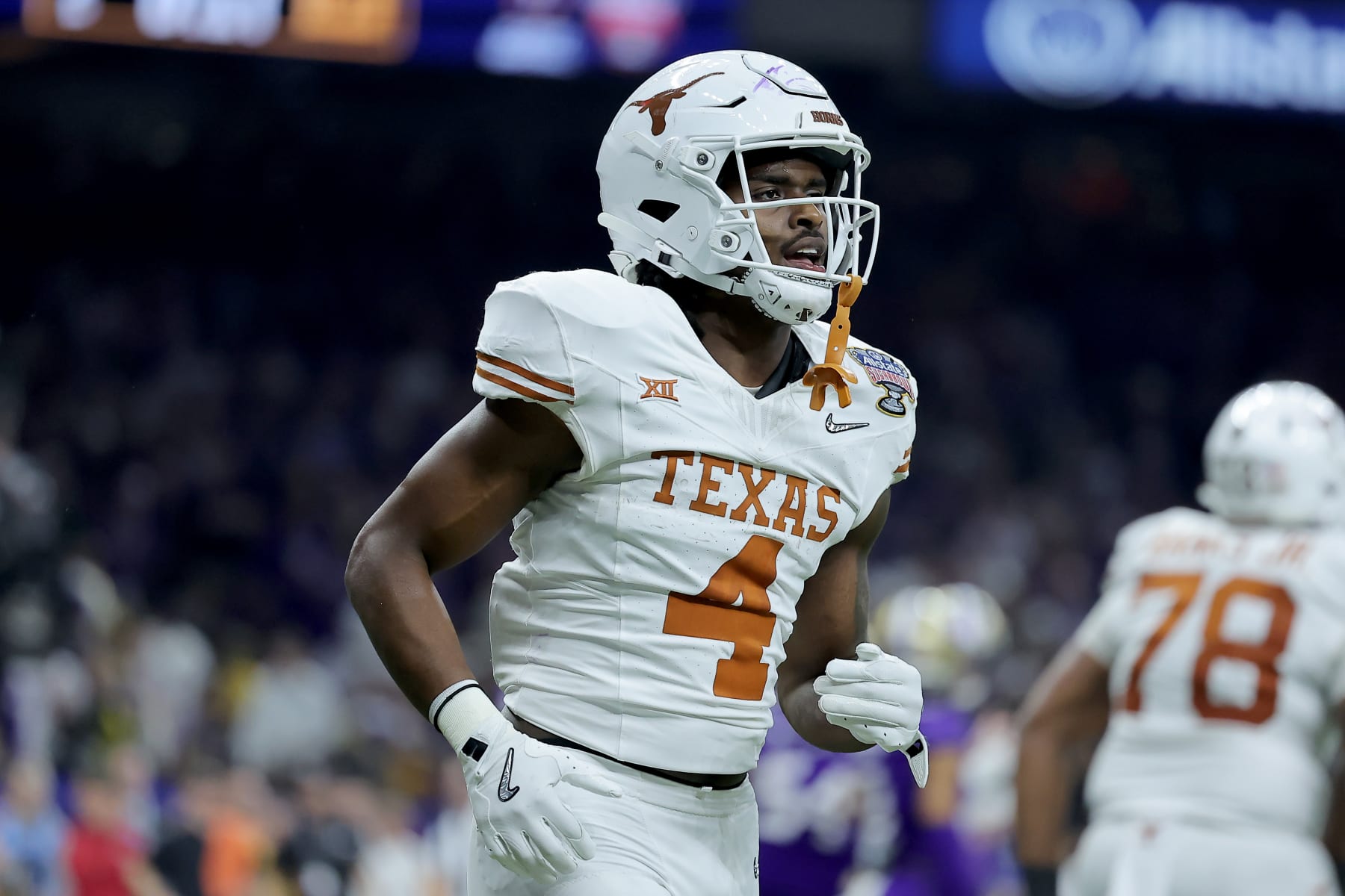 NEW ORLEANS, LOUISIANA - JANUARY 01: CJ Baxter #4 of the Texas Longhorns reacts after a touchdown during the second quarter against the Washington Huskies during the CFP Semifinal Allstate Sugar Bowl at Caesars Superdome on January 01, 2024 in New Orleans, Louisiana. (Photo by Jonathan Bachman/Getty Images)