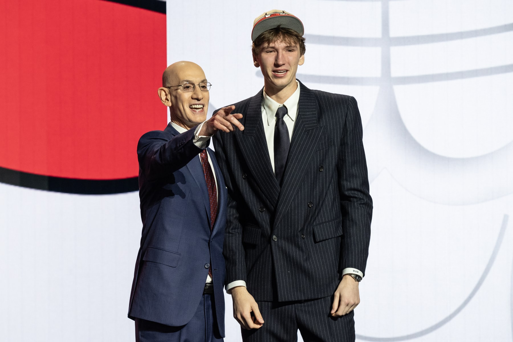 NEW YORK, UNITED STATES - JUNE 26: Commissioner Adam Silver poses for a photo with Matas Buzelis, selected as number eleven by the Chicago Bulls, in the first round of the 2024 NBA Draft at the Barclays Center in Brooklyn, New York, United States on June 26, 2024 (Photo by Lev Radin/Anadolu via Getty Images)