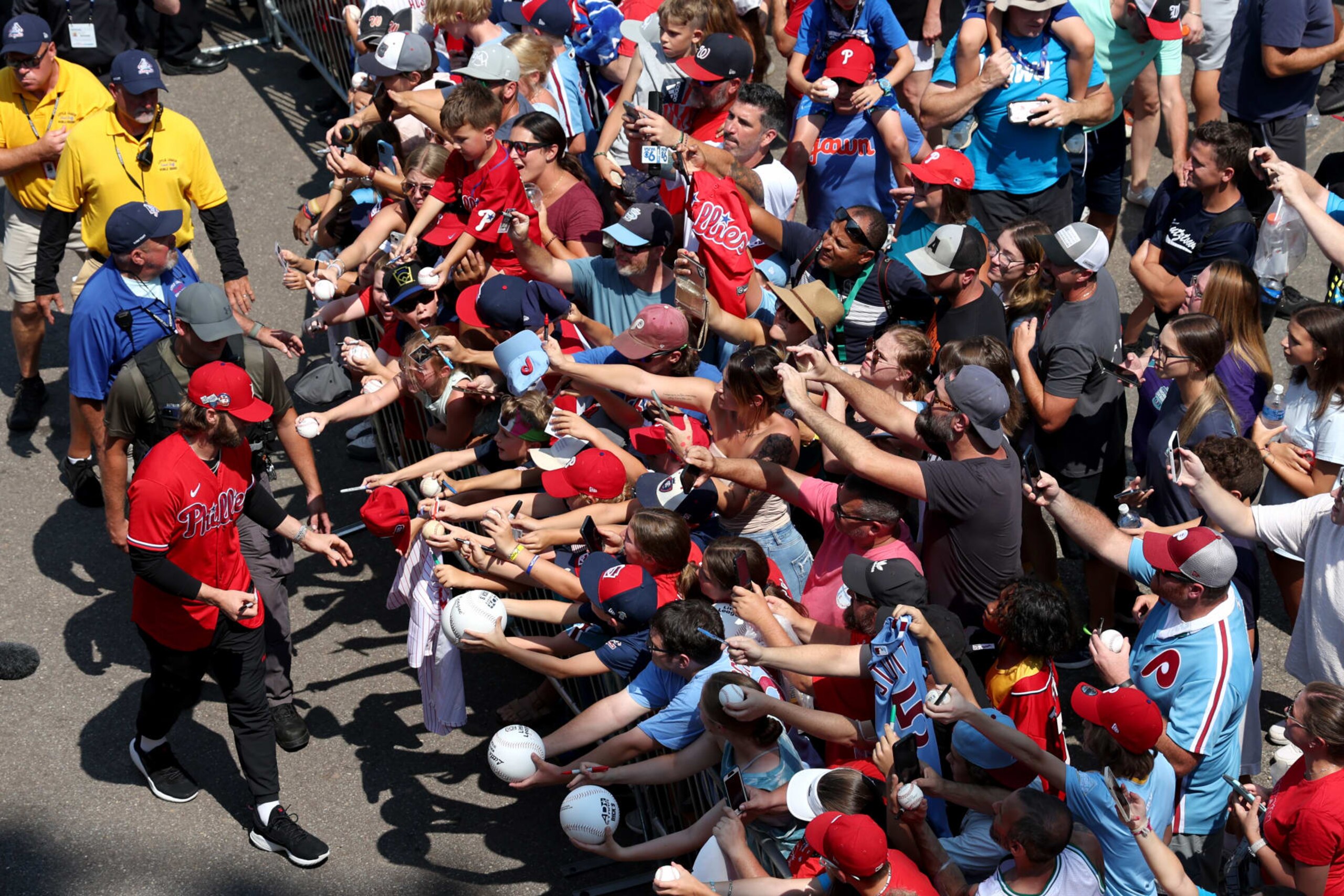 SOUTH WILLIAMSPORT, PENNSYLVANIA - AUGUST 20: Bryce Harper #3 of the Philadelphia Phillies signs autographs entering the stadium as members of the Phillies and Washington Nationals attended a Little League World Series game at Lamade Stadium before playing each other in the Little League Classic on August 20, 2023 in South Williamsport, Pennsylvania. (Photo by Rob Carr/Getty Images)
