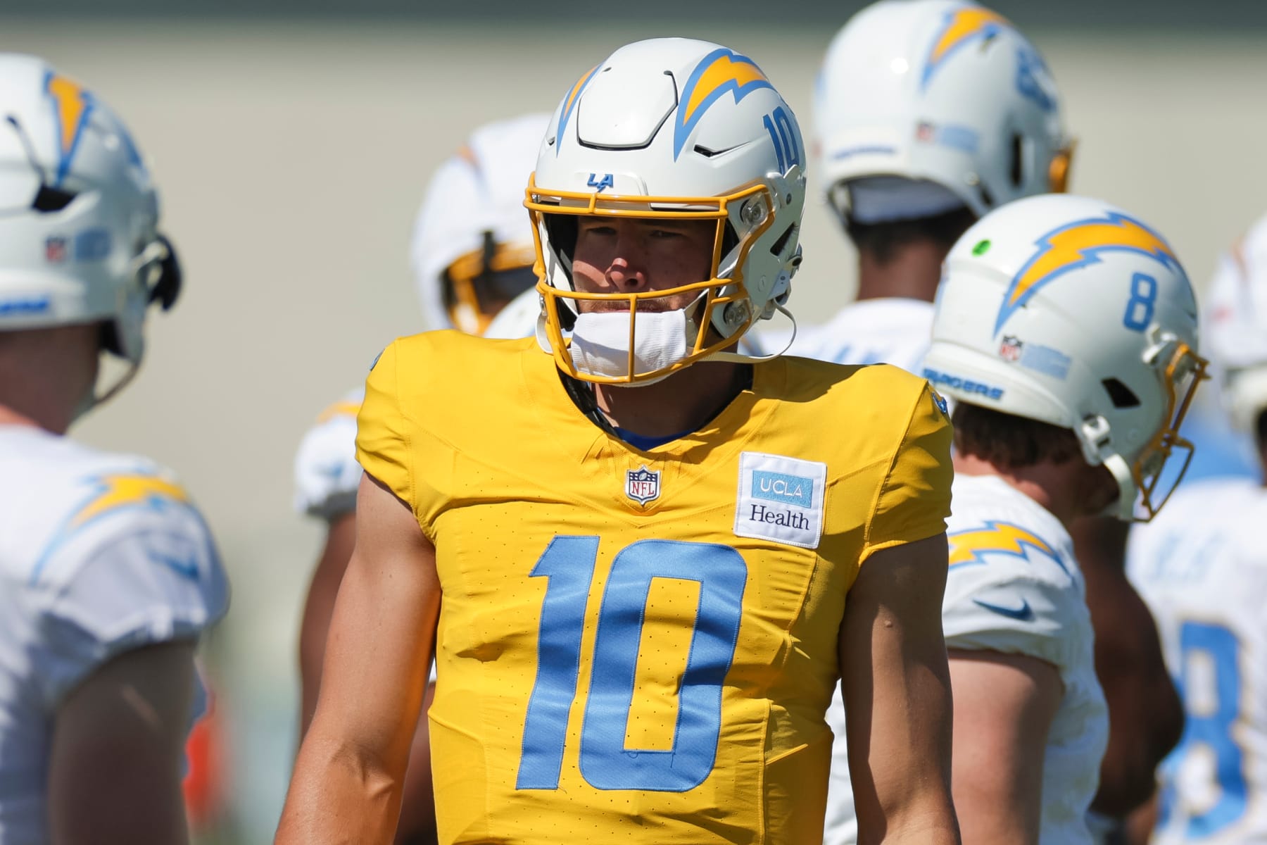 EL SEGUNDO, CA - JULY 29: Los Angeles Chargers quarterback Justin Herbert (10) stands with with teammates during the team's training camp at The Bolt on July 29, 2024 in El Segundo, CA. (Photo by Brandon Sloter/Icon Sportswire via Getty Images)